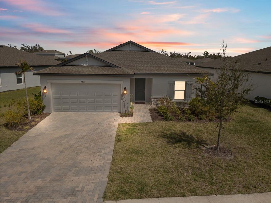 Beautiful like-new 4-bedroom, 2-bath home located in the desirable Trevesta community, featuring peaceful water views behind the home and a preserve setting at the front for added privacy. Offers 1% lender credit at closing. Built in 2022, major systems including the roof, AC, and water heater are all 2022 for added peace of mind.

The open-concept layout highlights a spacious kitchen with granite countertops, stainless steel appliances, wood cabinetry, and a large center island that flows seamlessly into the main living and dining areas—ideal for entertaining. Ceramic tile runs throughout the main living spaces, while the bedrooms offer comfortable carpeting. The owner’s suite includes a generous walk-in closet and a private bath with dual vanities. A screened lanai overlooks the lake, creating a relaxing outdoor space, and the laundry room is conveniently located near the two-car garage.

Residents of Trevesta enjoy resort-style amenities including a clubhouse, zero-entry pool with cabanas, fitness center, splash pad, playground, and scenic walking and jogging trails around the lakes. The community is centrally positioned with convenient access to I-75, I-275, US-41, and US-301, making it easy to reach Tampa, St. Petersburg, Bradenton, Sarasota, Lakewood Ranch, and nearby Gulf Coast beaches. Ideal for first-time buyers, seasonal residents, or investors looking for a well-maintained home in a vibrant community.