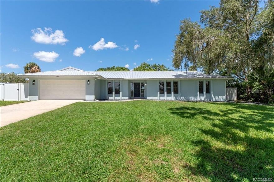 Are you looking for a beautiful home in a quiet neighborhood with the “country feel”, but still want the perks of being close to amenities? Look no further! Welcome to 4631 E Windmill Drive, an impeccably updated 4/2 home nestled in the heart of Inverness. From the moment you arrive, you'll notice the inviting curb appeal and spacious front yard. The view from the back includes a look at hole 9 of the recently closed Lakeside Golf Club, offering expansive views and a quiet backdrop. This home has been renovated inside and out with top of the line upgrades. Step inside to find a bright and airy layout with a seamless flow from room to room, accentuated by wood-look LVP flooring and custom blinds throughout. The kitchen is a true showstopper, with 2021 Samsung appliances, soft-close shaker cabinetry, under-cabinet lighting, quartz island, tile backsplash, Lazy Susan, custom pantry pullouts, and USB outlets—all illuminated by new dimmable recessed lighting. The kitchen island overlooks the living space and dining area, creating an open concept living space to enjoy all your family gatherings. Near the dining area, the beautiful style has been mimicked with a wet bar with its own sink and a wine fridge. One of the standout features of this home is its incredibly spacious bedrooms, offering plenty of room for rest, work, or play. The primary suite includes double barn doors that lead to a sleek en-suite walk-in closet & bathroom with a MASSAGING ELITE double shower head, enhancing both privacy and elegance. One of the additional bedrooms even has direct access to the second bathroom, giving you an opportunity to enjoy a double primary bedroom. The 4th bedroom near the kitchen can also be used as an office, for the work-from-home crowd. This home features a total of 2,423 square feet of living space, including a stunning 312-square-foot enclosed back porch, fully finished with a mini-split system—perfect for a sunroom or entertainment area. The remaining 2,111 square feet is under central air, ensuring year-round comfort throughout the home. The floors in the garage have been painted and epoxy sealed with 5-inch molding installed. The side garage door leads to a new Vinyl fenced in dog run or grilling area with double doors granting access to the front and backyard. Major system upgrades add tremendous value and peace of mind, including a new oversized drain field, a state-of-the-art, 80 gallon hybrid water heater designed for high efficiency and energy savings, and a metal roof installed in 2020. Additionally, the owners installed new fans and lighting through the home. exterior lighting, a smart reader to get daily readings on electric usage through SECO'S SmartHub, gutters, a 4 ton HVAC, Google nest thermostat, YALE smart door lock, Ring doorbell, freshly landscaped backyard and black slate rock installed around the front of the home, trim throughout the whole house, interior doors and hardware, interior and exterior paint, custom black high end push blinds.