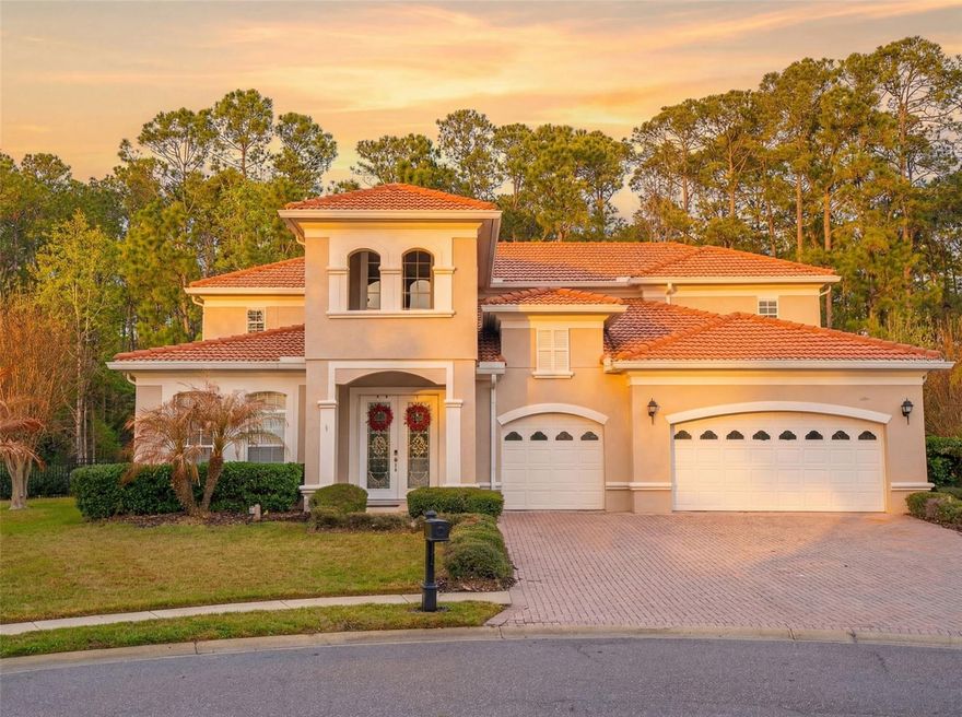 Welcome to 942 Elm Harbor Court, an exceptional residence nestled within the highly sought after guard-gated community of Magnolia Plantation in Lake Mary. Perfectly positioned on a quiet cul-de-sac and backing to serene wooded conservation within Wekiva Preserve, this 4-bedroom, 4-bath estate offers 3,729 square feet of refined living space and the privacy discerning buyers desire.  From the moment you arrive, the home’s presence is undeniable. Double entry doors open to a grand foyer where soaring ceilings and dramatic architectural detail immediately captivate. Each room is framed by graceful curved archways, showcasing elegant craftsmanship and timeless design. Custom ceiling treatments and extensive crown molding add volume, depth, and sophistication throughout.  Designed for both elevated entertaining and everyday comfort, the chef’s kitchen is truly the heart of the home. Generously scaled and open to the family room and breakfast nook, it features stainless steel appliances, double built-in ovens, granite countertops, and a substantial center island with seating—perfect for casual gatherings or culinary creations. The seamless flow between spaces creates an inviting atmosphere ideal for hosting on any scale.  French doors from the main living areas open to a sprawling, partially covered lanai that transitions effortlessly to the screened pool oasis. Wrapped in elegant travertine tile, the outdoor living space mirrors the sophistication of the interior. Here, tranquil conservation views provide a breathtaking natural backdrop. The gentle sounds of birdsong blending with the shimmer of the pool create a peaceful retreat—your own private sanctuary for entertaining, relaxing, and making lasting memories.  The primary suite, conveniently located on the first floor, offers both luxury and privacy. Upstairs, three additional bedrooms provide generous accommodations, along with an expansive bonus room filled with possibility—media room, executive office, fitness studio, or private guest retreat. French doors lead from this versatile space to a large covered balcony overlooking the pool and lush conservation beyond, delivering elevated views and a quiet place to unwind.  A custom wrought iron and wood staircase railing serves as a stunning architectural centerpiece, carrying the home’s elegance seamlessly from the first level to the second.  Beyond the home itself, the lifestyle is equally compelling. Magnolia Plantation is a 24-hour guard-gated community offering premier amenities including tennis courts, a playground, and a vibrant calendar of neighborhood events—from movie nights to festive holiday celebrations that bring residents together throughout the year. The community is also home to the renowned Mike Bender Golf Academy, adding to its prestige and appeal.  Ideally located, this residence offers convenient access to upscale shopping, fine dining, and major highways, making commuting to Orlando, business districts, and area attractions seamless. The property is also zoned for top-rated Seminole County schools, further enhancing its desirability for families seeking both excellence and convenience.  With a three-car garage, impeccable detailing, and a setting that blends luxury with nature, this Magnolia Plantation estate represents an extraordinary opportunity to own a private retreat in one of Lake Mary’s most sought-after communities.  This is more than a home—it is a lifestyle of distinction, serenity, and timeless beauty.