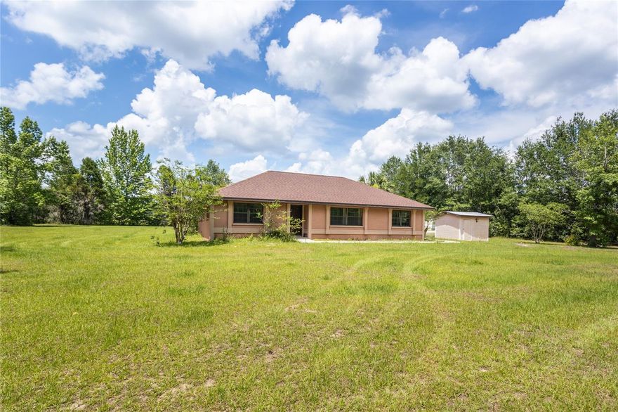 Welcome to your new home on 2.71 acres of beautiful rolling pasture, just minutes from Downtown Alachua. This home is the epitome of a well build home and has unlimited potential! The open floor plan living and dining area is perfect for entertaining and plenty of outdoor space for your own private Oasis!! It has a New (2022) roof as well as all New steel powder coated exterior doors that are not only added security but also insulated and energy efficient. You don't want to miss out on this hidden gem! Call today for your private tour!!