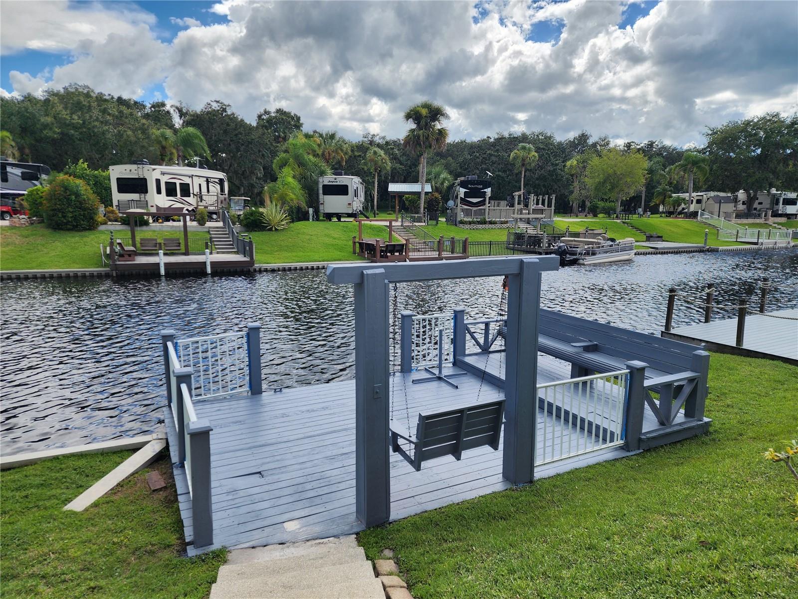 Welcome to 570 Waterway Drive, a scenic Luxury waterfront RV lot offering peaceful canal views and direct access to Lake Kissimmee and the Kissimmee River. Whether you're looking for the perfect weekend retreat or a great starter lot, this property offers natural beauty, convenience, and access to one of Central Florida’s premier outdoor destinations. Freshly Painted Private Wood Dock– Ideal for boating, fishing, or relaxing by the water; Dock Features Swing and Bench. Great starter lot for those looking to invest in the River Ranch lifestyle. Property is currently in the Resort's Rental program (Let your property make you money when you aren't using it!)
Location Benefits:
Just minutes from Westgate River Ranch, home to: Several on-site eateries, An abundance of activities, including horseback riding, rodeo events, and the new River Country Water Park
River Ranch RV Resort Owners enjoy exclusive discounts at Westgate eateries and the water park
Why You'll Love It: This is a rare opportunity to own a waterfront lot with private docking in an area known for its natural beauty, outdoor recreation, and community charm. Whether you're unwinding by the dock or heading out for a day of adventure, this property offers the best of both worlds.
Disclaimer: All information deemed reliable but not guaranteed. Buyer to verify all information to their satisfaction.
