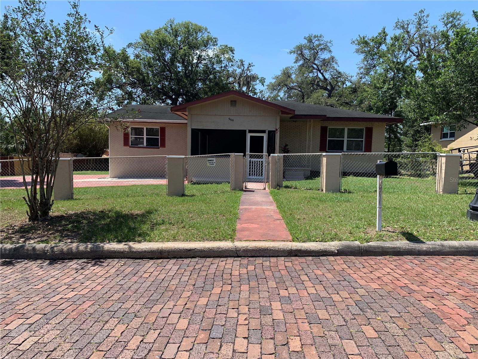 PRICE REDUCTION!! Located off of Lake Hunter on large fenced yard. Has screen front & rear porches with separate storaage shed in rear yard. Living room plus large family room with sliding glass doors onto porch. New paint, flooring. Has extra large kitchen with plenty of cabinets.