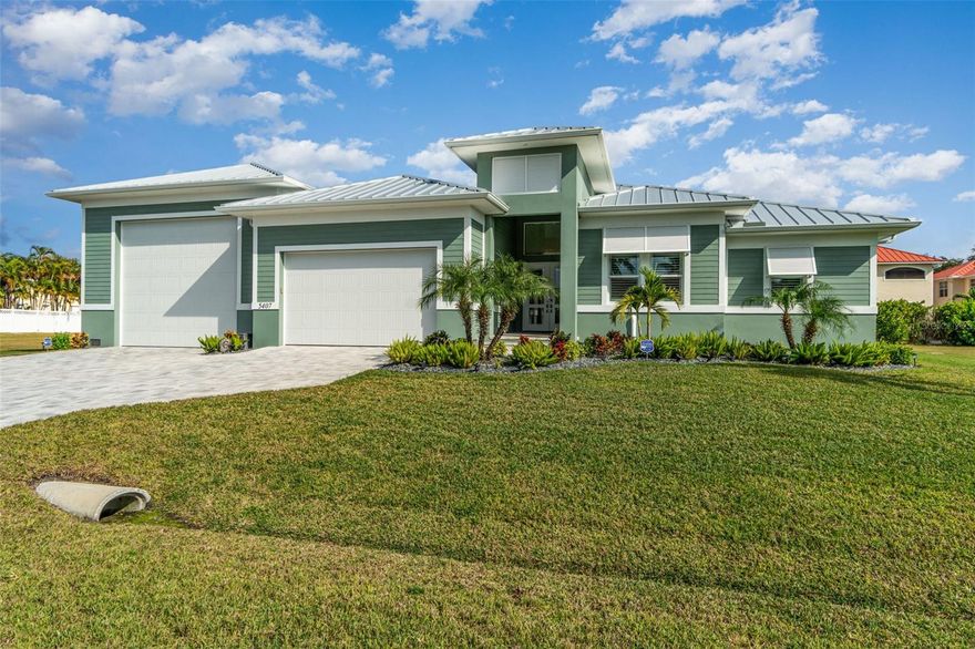 Prepare to be amazed by this one-of-a-kind luxury **RV-garage home** in the heart of SW Cape Coral, offering an unmatched combination of elegance, storage capacity, and true Florida lifestyle living. Designed for the automotive enthusiast, this property features a **50-ft deep, 25-29-ft wide custom RV garage** capable of parking up to six cars comfortably, in addition to the full two-car garage—with the ability to install a car lift and double-stack additional vehicles, making this a rare opportunity for collectors who demand space, security, and function. Behind the **RV garage is a 37-ft extended custom paver pad, ideal for additional parking, a boat trailer, jet skis, or outdoor workshop space.** Step inside to a beautifully upgraded home featuring custom blinds throughout, luxury finishes, high ceilings, and a thoughtfully designed split floor plan offering privacy and comfort. The open-concept kitchen includes premium cabinetry, spacious island seating, upgraded appliances, and overlooks the expansive great room with tray ceilings and elegant built-ins. The primary suite impresses with its spa-like bathroom, oversized walk-in shower, and a massive open closet layout designed for true livability. Step outside to your private tropical retreat, complete with a sparkling saltwater pool and spa, stunning paver lanai, and plenty of room for entertaining or relaxing under the sun. Additional upgrades include spray-foam insulation, instant hot-water recirculating system, smart home features, full alarm system with motion/window/door sensors, Bluetooth irrigation, high-speed mesh Wi-Fi across the entire property, attic storage access points, and multiple mini-splits for efficient temperature control—including two in the RV garage, one in the primary bedroom and the fourth in a guest bedroom.**** Designed for full-time residents, seasonal owners, or those seeking a high-performing rental, this home offers outstanding security features for locking off the primary suite and RV garage from guest-accessible areas.**** Located in one of Cape Coral’s most desirable neighborhoods, you are minutes from waterfront dining, live music, marina, pickleball courts, parks, and walking trails. Whether you’re an RV traveler, car collector, boater, or someone who simply appreciates exceptional craftsmanship, this property delivers a level of storage, comfort, versatility, and sophistication rarely found in one home. This is more than a house—it's a lifestyle, and an opportunity you won't find anywhere else.