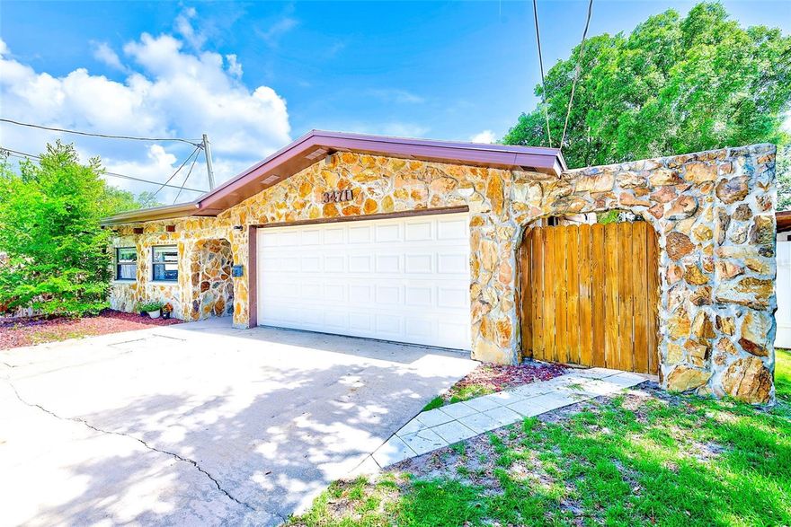 Enjoy the St. Pete lifestyle in this well-maintained block home located in quiet Floral Villa Park. Featuring a distinctive stone façade, bright open living space with wood-look flooring, and an updated kitchen with stainless steel appliances overlooking the pool, this home blends comfort and functionality.

Offering 1,454 sq ft, the layout includes 2 bedrooms, 2 full baths, plus a flexible bonus room off the primary suite, ideal for an office, gym, or optional third bedroom. The oversized 23’ x 18’ garage includes a Tesla NEMA charger, and the extended driveway with additional parking pad provides rare space for an RV, boat, trailer, or multiple vehicles.

Enjoy a private backyard with a larger-and-deeper-than-average pool. Centrally located within walking distance to the Jill & Heather YMCA, Main Library, and Jorgensen Lake Park, and just minutes to Downtown St. Pete, Central Ave, Tropicana Field, and the Gulf beaches. Easy access to I-275 and US-19, 15 minutes to PIE, under 30 minutes to TPA, and located in a no-flood zone.

Up to 2 pets permitted (no aggressive breeds) with $250 refundable deposit + $250 non-refundable fee per pet. Tenant responsible for lawn and pool maintenance; optional weekly pool service available for $160/month.