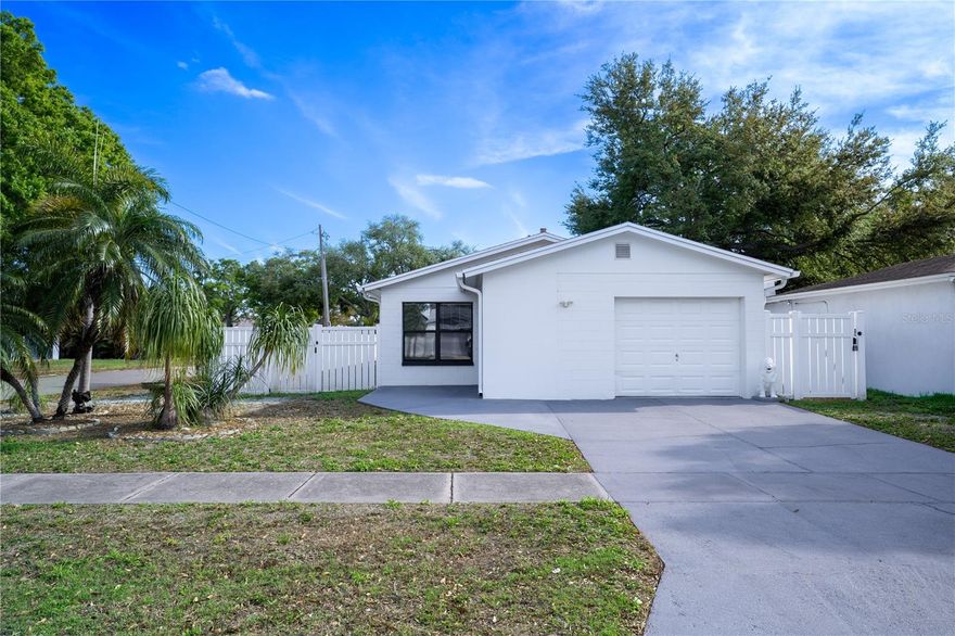 Welcome to this gorgeous 3-bedroom, 2-bathroom, 1-car garage single-family home in the heart of Pinellas Park, offering solid block construction, a prime central location, and situated on an oversized corner lot with desirable RV/boat parking. This home has been thoughtfully upgraded throughout the years, featuring a stylish 2025 kitchen refresh with quartz countertops and sink, porcelain backsplash, and sleek matte black hardware, along with an E-glass patio door by Andersen with a transferable warranty and updated ceiling fans. The spacious primary suite includes a walk-in closet and an en-suite bath with a walk-in shower, providing a comfortable private retreat. Additional recent improvements include fresh exterior paint with premium Sherwin Williams paint, a smart thermostat compatible with Alexa, and a fully fenced yard with vinyl fencing, complemented by a high-end Tuff Shed, concrete walkways, and a spacious screened patio with an insulated roof, perfect for enjoying Florida living year-round. Major system updates provide peace of mind, including the roof (2016), HVAC system (2016), updated electrical panel, hurricane shutters, hot water heater, and upgraded plumbing lines from the house to the street. With keyless entry, modern conveniences, and meticulous care throughout, this home is truly move-in ready, schedule your private showing today and experience all it has to offer!