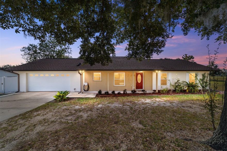 One or more photo(s) has been virtually staged. This well-maintained 3-bedroom, 2-bathroom home in Kingsland Country Estates sits on a .67-acre corner lot on a cul-de-sac and features a fully fenced backyard, a 12×20 shed, and a carport, all with no HOA fees! Inside, the bright and open living space boasts wood-like laminate flooring that flows seamlessly into the dining area, both complemented by vertical blinds that fill the home with natural light. The kitchen is functional and inviting, featuring LG Slate appliances, a pantry, and a pocket door, which provides flexibility to close off the kitchen when desired; perfect for creating a more formal dining atmosphere or adding privacy. An 8-foot slider in the dinette offers easy access to the backyard, creating a smooth connection between cooking, dining, and living areas ideal for family gatherings or entertaining. The primary suite offers wood-like laminate flooring, a walk-in closet with mirrored doors, and a private bathroom with a tile shower, sliding glass door, large mirror, and a privacy window. Bedroom 2 features carpet, vertical blinds, a ceiling fan, and a spacious closet. Bedroom 3 also has carpet, vertical blinds, a ceiling fan, and a closet with mirrored doors. The 2nd bathroom includes tiled floors, a single sink, and a tub/shower combination, while the hallway features a coat closet and linen closet for added storage. Additional updates include upgraded windows with Low-E coating, featuring a transferrable lifetime warranty, freshly painted interiors, an oversized 2-car garage with attic access, and a new hurricane-proof garage door. The HVAC system was replaced in 2016. The backyard and outdoor space are perfect for pets, play, gardening, or entertaining. With no HOA fees and thoughtful updates throughout, this property offers a move-in-ready opportunity to enjoy all that Kingsland Country Estates and Ocala have to offer.