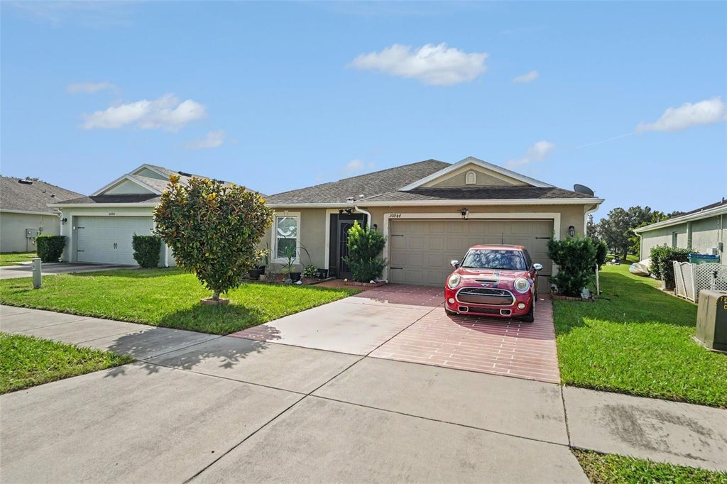 Photo of 30944 Water Lily Drive, Brooksville, FL 34602 (MLS # TB8560769)
