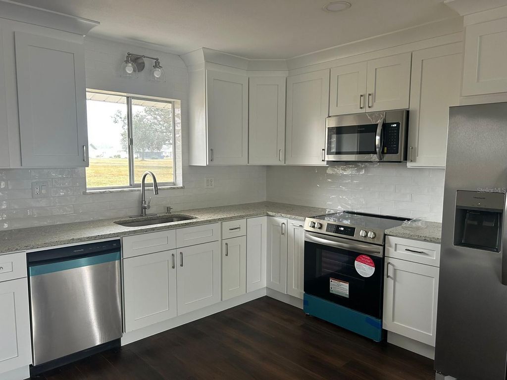 Photo of 702 Desert Hills Way, Sun City Center, FL 33573 (MLS # O6337837)