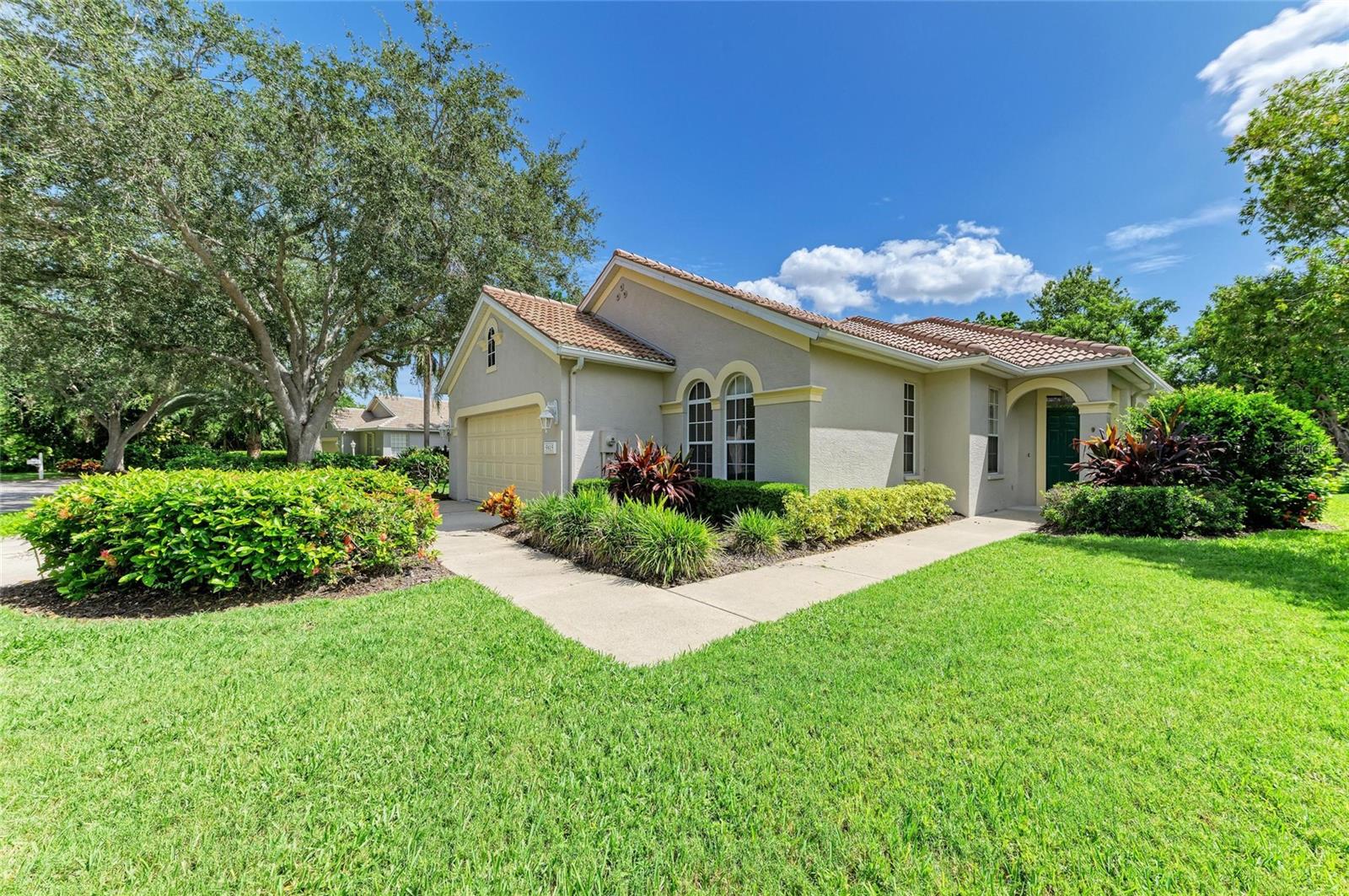 One or more photo(s) has been virtually staged. DARLING HOME! Located in premiere IMG country club community of THE GREENS AT EL CONQUISTADOR. Situated on a choice, deep lot on the cul-du sac with Eastern exposure, this charming home satisfies all the wish list. Pristine interiors are complimented by volume ceilings with recessed lighting, ceiling fans, tile floors, plantation shutters and decorative columns and arches. Updated kitchen with granite counters, tiled backsplash & generous cabinetry with upgraded hardware. A flowing, open plan with split bedroom design....guest bedroom plus a den/study with closet (easily converted to a 3rd BR) on one side with the primary bedroom in the rear enjoying restful views out to the private greenbelt with heavily treed preserve beyond...excellent walk-in closet with lovely bath featuring contemporary double square sinks, separate shower with new shower door and jacuzzi garden tub. This home is value packed with new a/c system (June 2024) PLUS a quality new barrel tile roof (September 2024). For those not wanting the care of a pool....this home has a private rear patio, but is pool free! (with room to add if so desire.) Interior laundry room and two car garage complete the list. The Greens is a very pretty neighborhood of only 43 single family homes with appealing Southern Mediterranean architecture and superior concrete block construction. Surrounded by preserves, lakes and the IMG golf course with sidewalks and garden benches around center lake encouraging nature walks with friends and pets. The ease of maintenance free yard care is included in the low HOA along with cable, Internet and outside water. Moments to golf, close to IMG Sports Academy and an easy zip to our renown Gulf beaches as well as the cultural arts of Sarasota. If you are ready for the Florida lifestyle now - this ideal home is vacant and available for immediate occupancy.