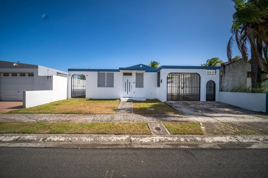 This one-story residence in Arroyo features an open layout and durable reinforced concrete (cemento armado) construction. Completed in 2001-2002, this 3-bedroom, 1-bathroom home includes a one-car carport with an adjacent storage closet and sits on a fully fenced lot. The property has been well-maintained, with windows updated approximately four years ago featuring titanium rods and a fresh application of exterior paint and sealant in December 2025. This residence is connected to the public sewer system and historically remained unaffected by flooding during Hurricane María. The lot offers the potential for the addition of a rear gate for direct beach access, providing a unique opportunity for coastal living.