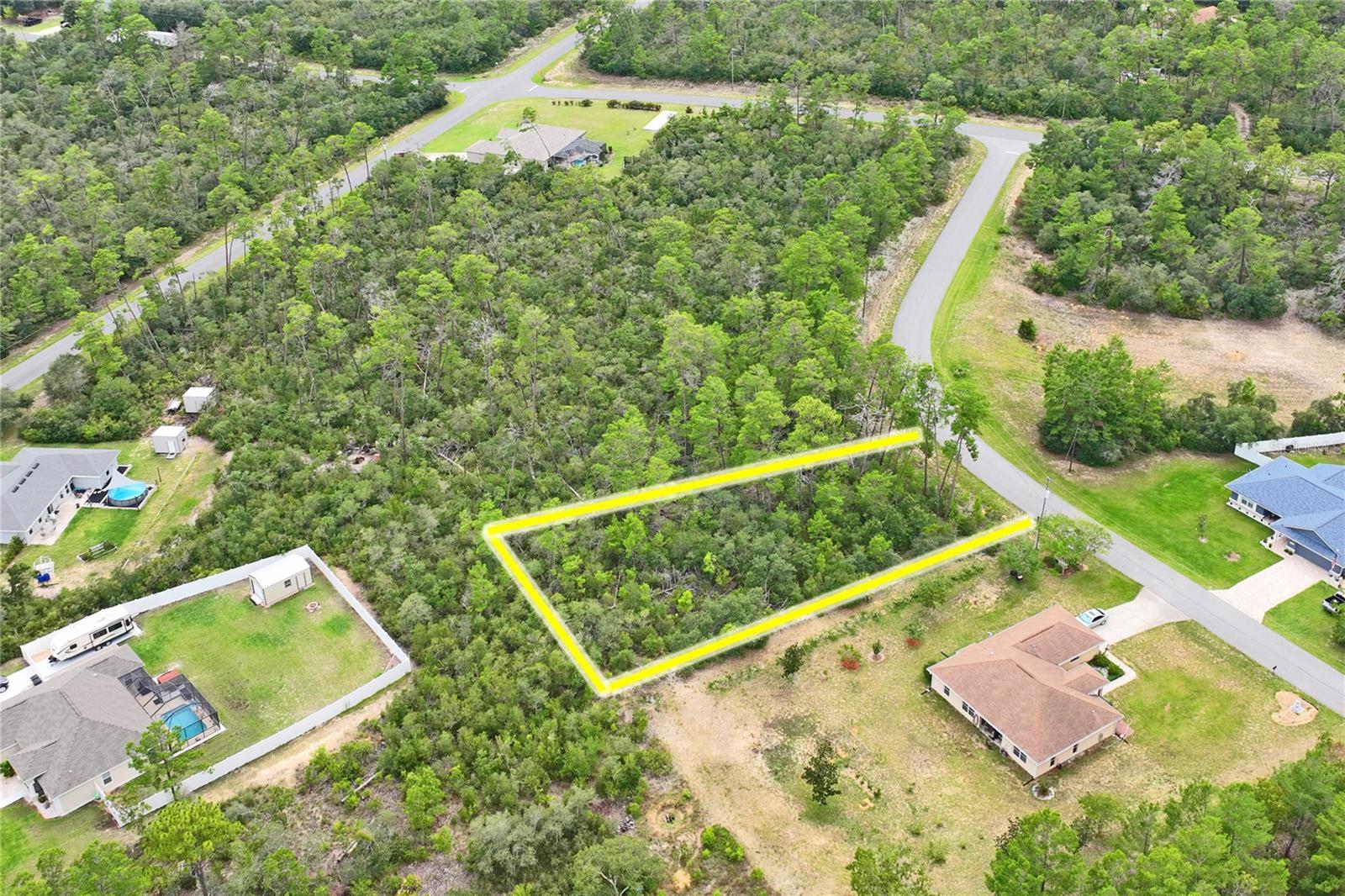 Serene 0.58-Acre Homesite in Citrus Springs – Ready for Your Vision! Welcome to your blank canvas in beautiful Citrus Springs! This .58-acre wooded homesite on North Newmark Way offers the perfect blend of peace, privacy, and flexibility to build your dream home whether it’s a cozy getaway or primary residence. The terrain is gently wooded, quiet, paved roads-ideal for enjoying community tranquility. Utilities: Public water available; septic required. Zoning: Residential/Rural (RUR) with no HOA for maximum freedom. Community Highlights: Nestled in Citrus County, known for its lakes, rivers, springs, and close proximity to the Gulf of America. Access to the scenic Withlacoochee State Trail—perfect for biking, hiking, and outdoor adventures. Close-knit community amenities: golf, tennis, parks, community center, library—all just a short drive away. Why You’ll Love It: Clean slate with no structure—build exactly what you envision