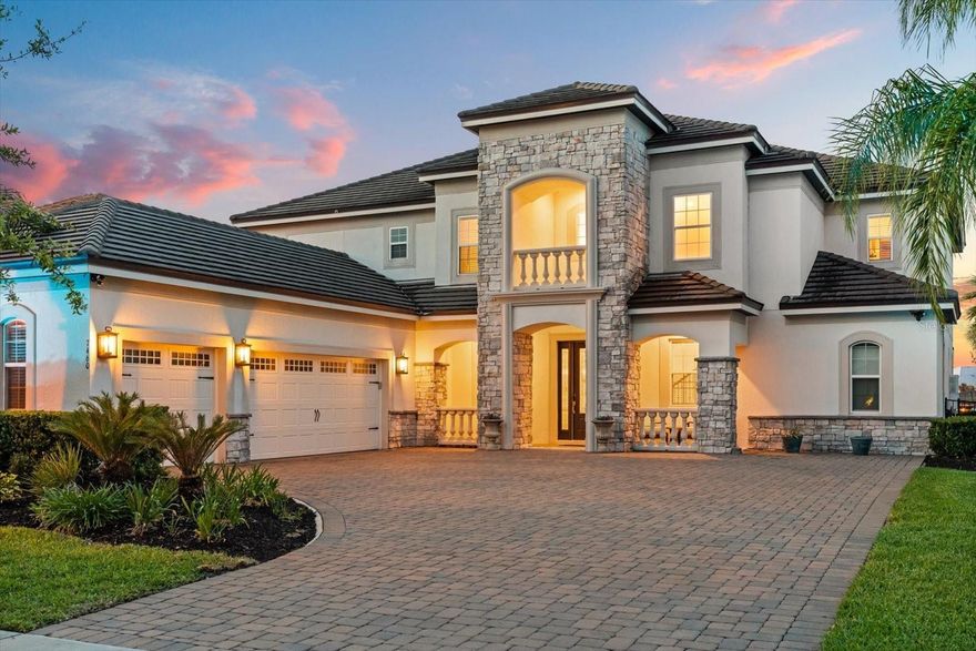 Experience lakefront luxury at its finest. Situated on the pristine shores of Lake Hancock in the gated Overlook at Hamlin, this 2020-built Mediterranean masterpiece offers the perfect blend of elegance and recreation. Boasting 6 spacious bedrooms and 5.5 baths, this home features an open-concept layout with soaring cathedral ceilings and high-end finishes throughout. The gourmet kitchen, complete with a massive island and walk-in pantry, flows seamlessly into the living areas—all offering stunning water views. Step outside to your private oasis featuring a salt-water pool and a custom composite dock (2022) ready for skiing or sunset cruises. With the primary suite on the main floor and a massive upstairs game room, there is space for everyone. Enjoy the best of Winter Garden living with top-rated schools and world-class community amenities.