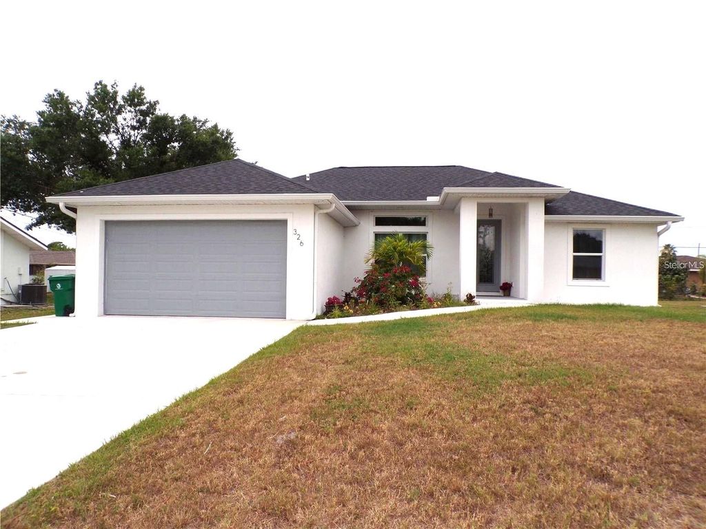 Photo of 334 Millport Street NW, Port Charlotte, FL 33948 (MLS # C7510148)