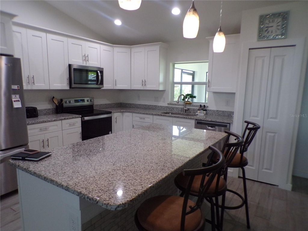 Photo of 334 Millport Street NW, Port Charlotte, FL 33948 (MLS # C7510148)