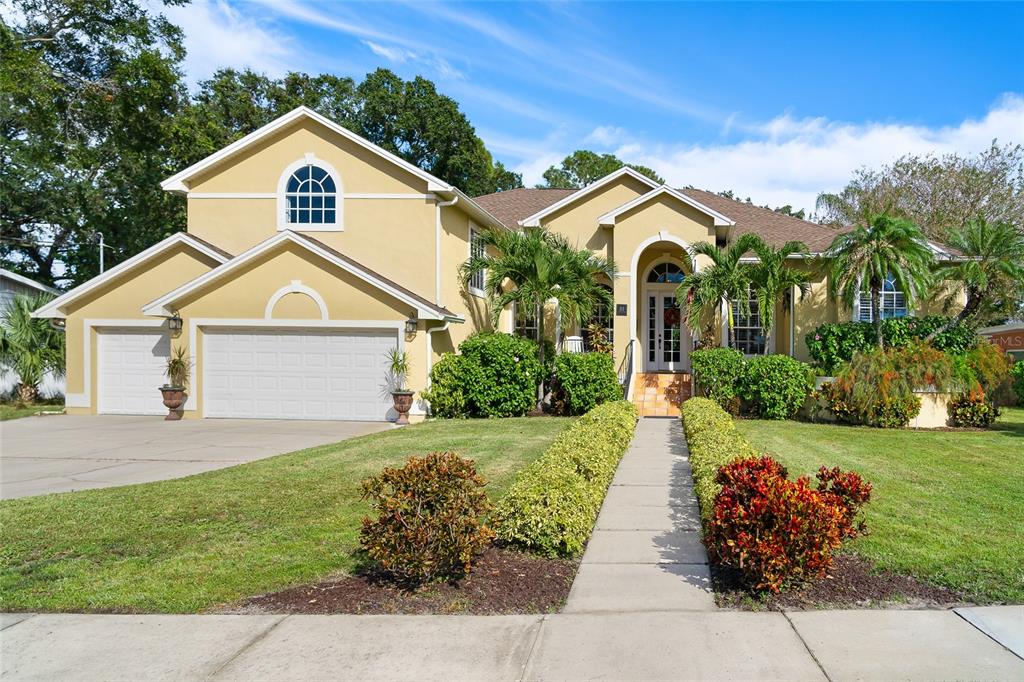 Stunning and extremely well built home on a double lot, 102 x 171, with 4,132 sq ft. of living area with 12-14 ft. ceilings throughout; all on one of the most desirable streets on the island with water views. Elevated for lower flood insurance premiums. The first floor features a lavish master suite with large bath, office/den, formal sitting room, dining area, and a large kitchen with breakfast nook that opens to
the family room boasting tons of natural light. Beautiful views of the Bay from the Master bath, office/den, dining area and front porch! In addition, 3 very large bedrooms with closets and two full baths. Upstairs, is an expansive space with bath that can serve as a second Master, guest suite, or a movie or game room. So many opportunities! Out back, is the true treasure with a huge, covered lanai with absolute privacy. Ideal for relaxing, entertaining, dining and simply enjoying the Florida weather year-round. Oversized pool and new drainage and activity grass in back yard, providing worry free living and absolute beauty! Updates throughout, including kitchen; wood flooring; new AC units, hot water heaters, Generac generator, whole house water filtering/softener system, and large outdoor kitchen.
There is a 3 car garage with Tesla charger installed. The large side yard area allows for boat parking behind a double gated fence. New roof in 2015 with a 25-year transferrable warranty. Davis Islands is an exclusive island community with its own private community airport, the Davis Island Yacht Club, and a charming center village with popular restaurants. Conveniently located to downtown Tampa. The University of Tampa, and Tampa International Airport.