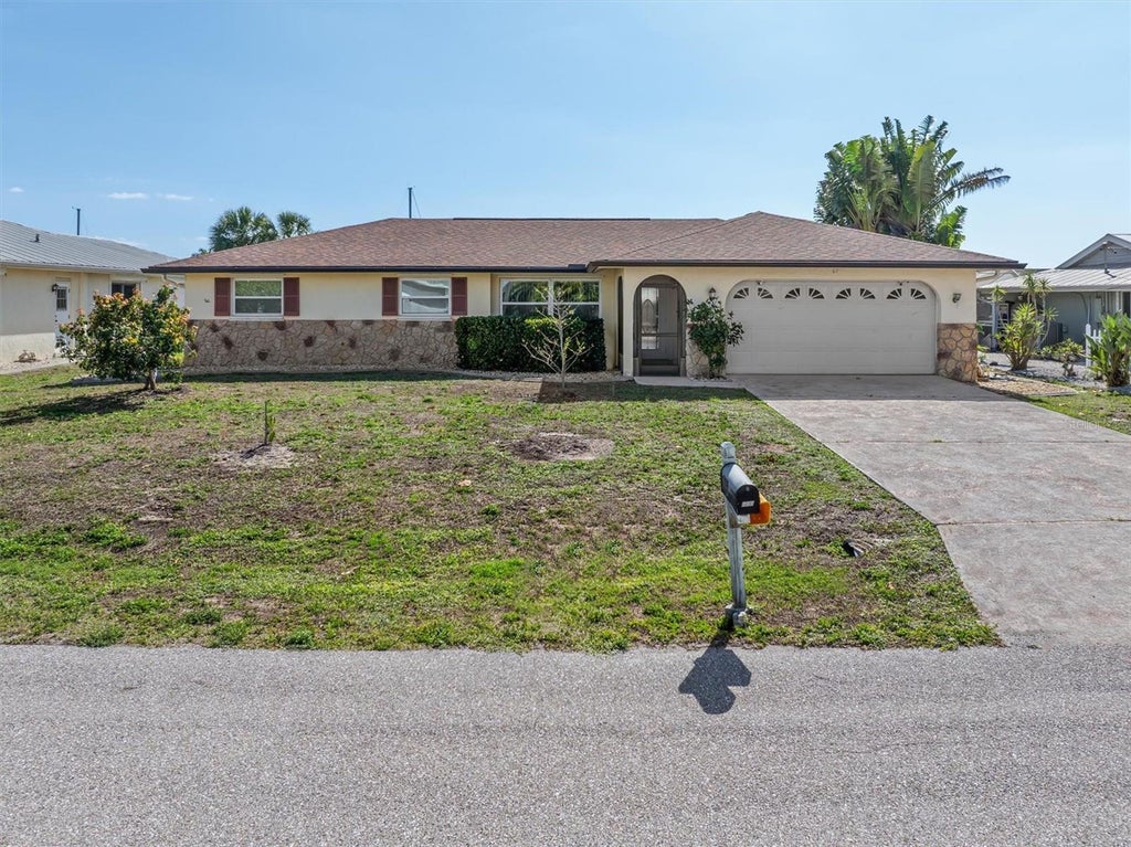 Photo of 109 Peckham Street SE, Port Charlotte, FL 33952 (MLS # C7530639)