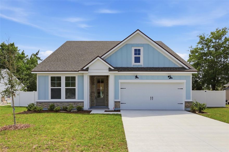 One or more photo(s) has been virtually staged. Welcome to this beautifully crafted new construction Green Home by Hunter Quinn Homes, featuring the highly sought-after Pimlico floor plan—a spacious, high-performance home designed for energy efficiency, comfort, and modern flexibility. This thoughtfully designed home offers an open-concept layout filled with natural light, complemented by 9-foot ceilings, 8-foot solid interior doors, and LED lighting throughout, creating a bright and inviting atmosphere. A standout feature of the Pimlico model is the upstairs bonus room, offering incredible versatility—perfect as an additional bedroom, media room, playroom, music room, teen loft, or home office to fit your lifestyle needs. Built as a high-performance, energy-efficient home, this property includes energy-rated windows with a 15-year warranty, a radiant roof barrier system that deflects heat, spray foam insulation for superior air sealing, and dual-zoned thermostats—all designed to reduce energy consumption, lower utility costs, and enhance year-round comfort. Constructed to perform in Florida’s humid climate, this home prioritizes durability and long-term value. Additional low VOC paint and flooring materials promote healthier indoor air quality. The kitchen is designed for both style and function, featuring Calcutta quartz countertops, 42-inch cabinetry, and modern finishes ideal for entertaining or everyday living. The primary suite offers a private retreat, complete with a luxurious ensuite bath featurin and low-flow Moen fixtures, along with convenient access to the laundry room. This smart home-ready property includes integrated technology with the ability to expand smart features, giving homeowners flexibility for future upgrades. Additional exterior highlights include an oversized concrete driveway and a desirable side-load garage, enhancing curb appeal and functionality. The garage is fully finished, drywalled, and painted, a quality standard with Hunter Quinn Homes.