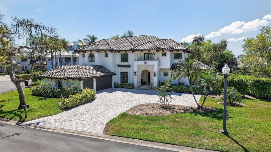 Situated within the highly coveted gated, water-access enclave of Caya Costa, this exceptional Spanish Mediterranean estate-style home offers a level of quality and distinction that is truly second to none. Offering over 4,259 square feet of refined living space, block construction, on a 0.34-acre homesite, the residence seamlessly blends grand architectural presence with thoughtful modern updates and effortless indoor-outdoor living. A grand entryway welcomes you into an open floorplan with formal living and dining rooms, and an elegant great room with a soaring cathedral ceiling, built-in bookcases, stained glass interior doors, and anchored by a fireplace—perfectly designed for both entertaining and everyday living. The formal dining room is highlighted by a striking stained-glass picture window, while the home’s wet bar enhances its entertaining appeal. The deluxe chef’s kitchen features stainless steel appliances (2024), including a Thermador oven, Frigidaire range, Bosch dishwasher, and a newly customized pantry. With TWO PRIMARY SUITES (one upstairs / one downstairs) and four guest rooms, an upstairs loft, two laundry rooms (one upstairs / one downstairs) five full bathrooms, and one-half bath, the home offers exceptional comfort and flexibility for family and guests alike. Step outside to an expansive resort-style pool deck with multiple loggia lounge areas surrounding a beautiful pool and spa, newly converted to saltwater—an idyllic private retreat. The property has undergone extensive 2024–2025 upgrades, including a new tile roof, chimney, gutters with in-ground drainage, irrigation control system, two new HVAC systems, garage doors, wrought iron front railings, paver driveway and side landings, surge protectors, custom cabinets in 1st level laundry room, built-in family room bookcases, new shades in the great room & kitchen, ceiling fans, and fresh exterior paint, along with all-new front and side yard landscaping. An oversized three-car garage completes the offering. Residents of Caya Costa enjoy 24/7 staffed guard-gated security, a community pool with two-story deck and covered pavilion, tennis and pickleball courts, scenic lakes with abundant bird life, miles of walking paths, fishing dock, and a private boat ramp with optional boat, jet ski, and kayak storage providing direct access to Tampa Bay. All of this located just minutes from downtown St. Pete, the 4th Street N shopping and dining corridor, with easy access to I-275, Gandy Blvd, TIA, and PIE. A rare opportunity to own a beautifully updated luxury home in one of St. Petersburg’s most highly sought after gated communities. The home has no known history of flooding or storm damage. Buyer to verify all measurement.