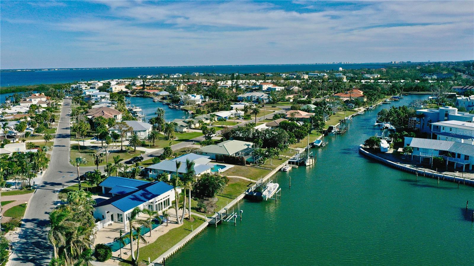 Discover Coastal Living with year-round SUNSETS and DEEDED Beach Access...... at Its Finest in Emerald Harbor. Welcome to the highly sought-after Emerald Harbor community on Longboat Key, where coastal charm meets the serene beauty of waterfront living. This West-exposed residence offers an exceptional location with stunning water views and over 100 feet of direct waterfrontage along a wide, deep sailboat-accessible canal. With no bridges in the way, you have direct access to the Intracoastal Waterway, providing a perfect setting for boat enthusiasts.
While the recent hurricane did cause some water intrusion, this presents a rare opportunity to customize and elevate the property to your exact specifications. You can transform this home into your dream residence, tailored to your high standards of coastal living and resilience.
Inside, natural light pours into the spacious living area through large windows and sliding glass doors, creating a warm and inviting atmosphere. The open-concept layout seamlessly connects the living room to the kitchen, making it an ideal space for entertaining guests or enjoying family time. The generously sized bedrooms offer privacy and comfort, with endless potential for customization.
Step outside into your private backyard retreat, where you can enjoy the beautiful Florida weather year-round. Whether you envision a peaceful garden oasis or a lively outdoor entertainment space, this home offers a blank canvas to bring your vision to life.
Emerald Harbor is a premier residential community located just 2.2 miles from the north end of Longboat Key and 7.7 miles from the south end. The community consists of 82 beautifully landscaped residences, each sitting on spacious lots of 0.3 to 0.6 acres—all properties front wide, deep-water canals, providing easy access to Sarasota Bay and the Intracoastal Waterway. Additionally, the community features a private, 20-foot-wide white-sand Gulf beach with benches, accessed via a lush, foliage-lined path from Gulf of Mexico Drive to the Gulf of America.
This is a rare opportunity to own in one of Longboat Key's most exclusive communities. Don't miss your chance to create your ideal waterfront home in Emerald Harbor.