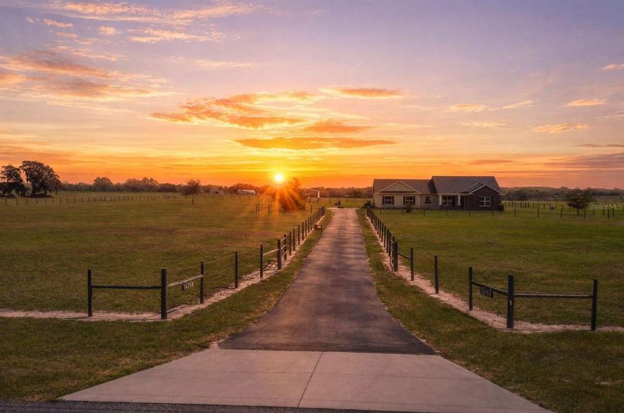 Opportunities like this are becoming increasingly rare in Lake County. Set on nearly 9 acres of cleared, usable land, this 2018-built block home offers the perfect blend of modern construction, equestrian functionality, and peaceful country living.

From the moment you arrive, the property opens up to wide pastures, two farm-fenced paddocks, and unobstructed rural views that stretch toward Lake Cooley and Island Lake. Whether you're a horse enthusiast, hobby farmer, or simply someone who values privacy and space, this property was designed for a lifestyle many people search for but rarely find. The acreage is surrounded by hotwire fencing to help protect livestock, providing both functionality and peace of mind for animal owners.

Inside, the home features 14-foot ceilings and an open-concept layout that creates an immediate sense of space and natural light. The split bedroom floor plan provides privacy, while the oversized primary suite offers a true retreat with a massive walk-in closet and seamless walk-in shower.

Built for both comfort and efficiency, the home includes exterior wall insulation that helps keep the home energy efficient, with electric bills typically under $180 even during the summer months, along with the added peace of mind of a brand new 2024 roof. The property is also served by a deep well providing clean, natural water, a valuable feature for rural living.

Outside, the land is already prepared for animals and outdoor living. The property includes two fenced paddocks and a two-stall barn complete with a large tack room and washing station. Two covered carports provide plenty of room for trailers, equipment, or recreational vehicles.

Relax on the screened porch overlooking nothing but open pasture and peaceful water views, where the pace of life slows down and the surroundings speak for themselves.

Adding even more flexibility, the property allows for an additional dwelling unit, making it ideal for creating a family compound, guest home, or private in-law suite while still maintaining the space and privacy the land provides.

Despite the quiet country setting, the property remains conveniently located approximately 20 minutes from Mount Dora, about an hour from Orlando, and roughly an hour from Ocala, providing easy access to dining, shopping, entertainment, and world-class equestrian venues.

Properties offering newer construction, nearly 9 acres of usable land, equestrian infrastructure, and lake views are incredibly hard to find. This is more than a home. It's a lifestyle.