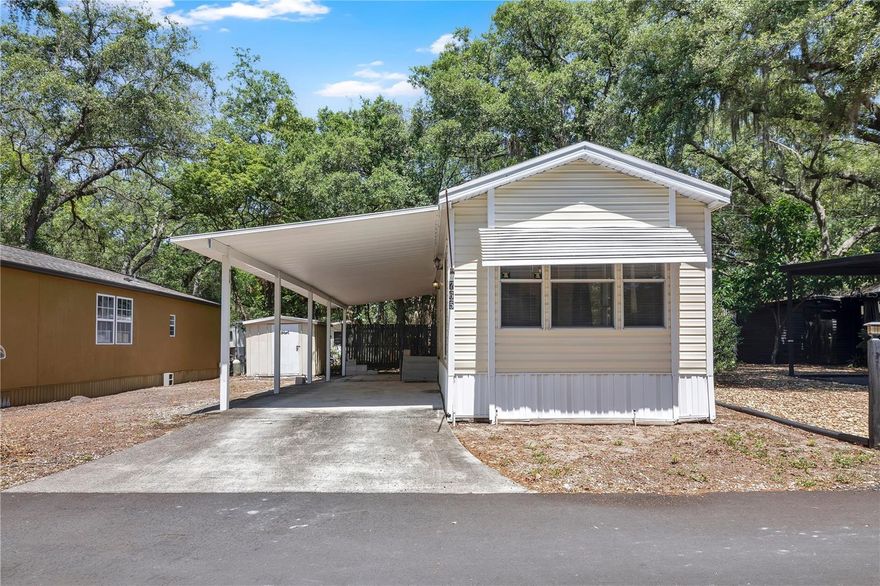 Upgraded Move-in ready manufactured home with lot in Land Owned community. This home offers Luxury Vinyl flooring throughout, Quartz countertops in kitchen and Bathroom, upgraded appliances and finishes.  Shed included for extra outdoor storage. Residents enjoy access to incredible amenities including the following- 110,000 gallon pool, kiddie pool, playground, basketball, mini putt-putt golf courses, shuffleboard and horse shoes. Community features a virtual entry gate. Several pool houses strategically placed throughout for showering and laundry machines. Rec Hall had holds bingo, and holiday meals hosted by the association. There is a Trading post store located up front for convenience items and hot food. Close to restaurants, shopping, highways, etc. HOA Fee includes water, sewer, trash, leaf pickup. The community maintains private sewer and water systems on site.