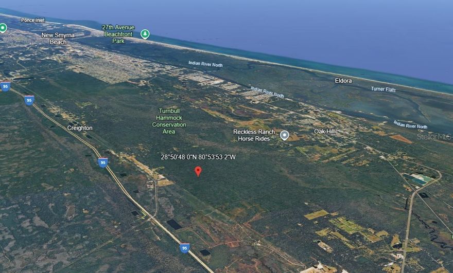 This 2.5-acre vacant land parcel in Oak Hill, Florida. No road access.