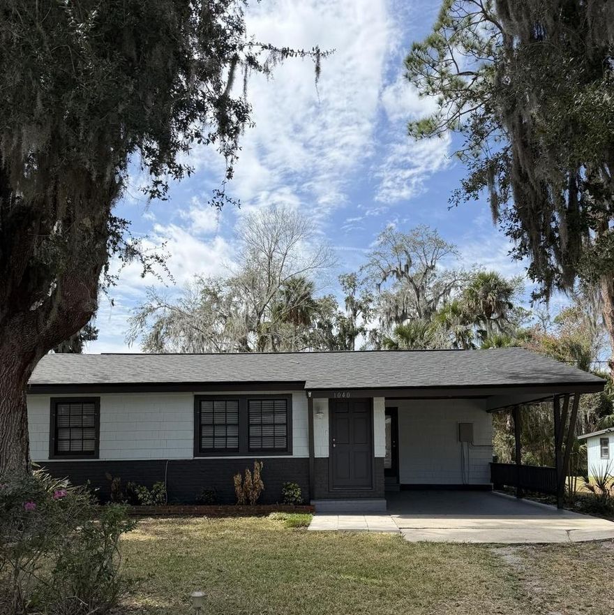 Opportunity meets location with this versatile expansive property just 4 miles to the sandy beaches of New Smyrna Beach. Whether you're an investor, builder, or buyer looking to create long-term value, this property offers exceptional potential. The existing move-in ready 2 bedroom, 1 bath home features many recent updates throughout the open floor plan including stainless steel appliances, a four-season sun room, and a dedicated laundry room. Improvements include a newer roof (2025), AC (2018), minimizing immediate capital expenses. The beautiful, expansive lot and large 20 x 20 workshop/shed (hook-up ready), provides flexibility for future development, expansion, or additional storage. Build your dream primary residence while utilizing the current home as a guest house, rental, or in-law suite. With ample room for boat and RV parking, this property appeals to both short or long term rental possibilities. Located in a quiet setting just minutes from beaches, dining, and entertainment.  Don't miss this opportunity, schedule your showing today, easy to see!