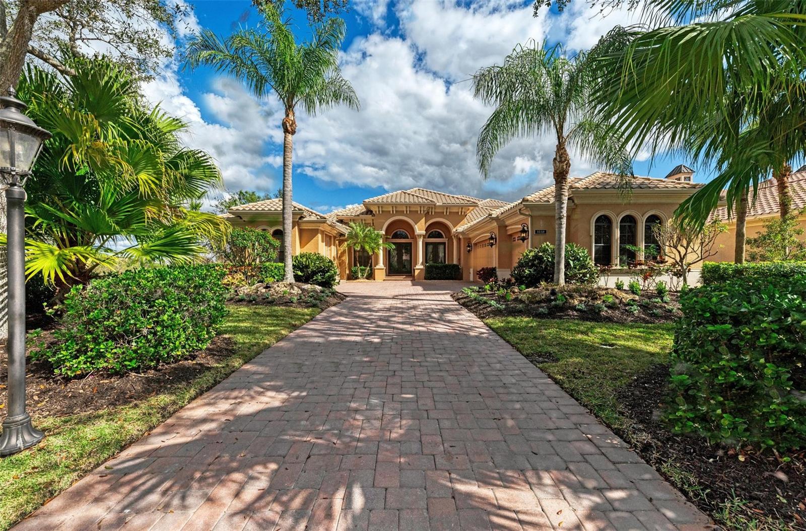 *** Open House Cancelled - Home is Under Contract. *** Gorgeous custom Lee Wetherington home in The Founders Club! This exquisite residence offers character and incredible views! Boasting a location that cannot be compromised and exceptional craftsmanship for the most discerning client, this lovely estate is immaculate. Nestled against a protected preserve with sweeping views of the private golf course. Pulling into the gated neighborhood, a winding road leads you past unique homes that are anything but cookie-cutter and through an established neighborhood studded with glorious ancient oaks and over 700 acres of protected nature and preserved land. Arriving at 3549 Founders Club Dr., a deep paver driveway welcomes you to a substantial home with a timeless exterior. Double glass doors lead to a marvelous interior. Stunning floor-to-ceiling windows frame views of nature and the picturesque view of the 17th hole. The open great room offers seamless indoor-outdoor living. A striking gourmet kitchen offers quality custom wood cabinets and pull out drawers, granite countertops, built in wine storage, chef’s island, natural gas cooktop, and stainless appliances. Read by the fireplace or watch nature from the open living area with oversized windows adjacent to the kitchen. In the great room, disappearing sliders lead to the captivating outdoor area with heated pool, waterfall spa, and large covered lanai perfect for enjoying the outdoors even on rainy days. This immaculate home is almost 4,300 square ft. and includes a bonus room, executive office or 5th bedroom, and a flex-room. All primary space is on the first floor including main bedroom, two guest suits, executive office, and flex room. The second story with bonus room, wet bar, spacious bedroom, full bathroom and balcony provides the perfect space for family or guests who desire privacy. Designer details are abundant from classic trim details to the beautiful ceilings with ambient lighting, double crown, and tongue & groove ceiling finishes inside and outside. The handsome office/den offers unforgettable views, rich custom cabinet built-ins, and a prime space to be productive or unwind. The owner’s wing boasts dual dressing rooms with high-end built-in organization closets, a separate shoe closet and an additional office, den, or exercise space. The owner’s bath is a luxury retreat with a jetted tub, Roman shower, and dual vanities with sitting area. Built with meticulous attention to detail, this home has been lovingly maintained. No CDD fees, and optional social/golf memberships. The Founders Club is in a prime Sarasota location (non flood zone X), bordering Lakewood Ranch, and just 3 miles east of I-75 and approximately 9 miles to downtown. Enjoy close proximity to the cultural attractions of downtown Sarasota, while being nearly adjacent to the restaurants, shops, and farmer’s market of LWR Waterside. Easy access to UTC, airport, grocers, medical facilities, polo fields, and so much more. Come see what makes this home and neighborhood truly exceptional.