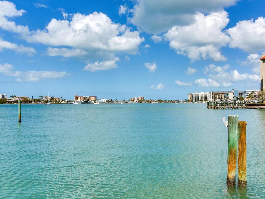 Waterfront Luxury. Private Living. Unmatched Location. A Rate Boater’s Paradise - Welcome to your private coastal sanctuary in the prestigious waterfront community of Island Estates where panoramic views of Clearwater Bay, glowing Gulf sunsets, and effortless boating access create a lifestyle few properties can offer.
This exceptional 2 Bedroom | 2 Bathroom | Move-In Ready residence lives like a single-family home yet offers the ease of low-maintenance condo living within an exclusive four-unit boutique building. No shared hallways. No crowded amenities. Just privacy, tranquility, & uninterrupted waterfront beauty at the end of a quiet cul-de-sac.
A True Boater’s Paradise - Step outside your back door to a rare, deeded boat slip with 10,000-lb lift and a double Jet Ski lift, a feature nearly impossible to find this close to Clearwater Beach.
Recent waterfront enhancements include:
• New dock flooring
• Expanded waterfront patio with canopy
• Direct access to pool and grilling area
• Private double-entry front doors
Launch for a sunset cruise within minutes or relax dockside as dolphins and manatees pass by. Enjoy front-row views of the beloved Island Estates Holiday Boat Parade right from your backyard.
Panoramic Water Views From Nearly Every Room - Wrapped in windows, this light-filled residence showcases sweeping Clearwater Bay vistas and unforgettable sunsets over the Gulf.
The expansive living and great rooms with 9-foot ceilings create an open, airy atmosphere where indoor and outdoor living blend seamlessly. Large windows frame the water from multiple vantage points, filling the home with natural light and providing a constantly changing coastal backdrop.
Designer Kitchen & Thoughtful Updates- The stylish kitchen blends form and function with updated stainless-steel appliances, under-cabinet lighting, & a designer backsplash, creating a bright and efficient space for everyday living or entertaining.
Throughout the home, porcelain tile flooring provides a cohesive & sophisticated look while enhancing durability and ease of maintenance. Both bathrooms have been tastefully upgraded with elegant porcelain tile finishes.
Extensively Upgraded for Comfort & Peace of Mind - Significant improvements have been completed to ensure modern comfort & long-term value, including:
• New Roof and Carport Roof 
• PGT Impact Windows for efficiency and storm protection
• Hurricane Shutters 
• New Entry, Patio, and Pool Doors 
• New A/C Unit in Great Room
• Updated Plumbing
• Electrical Panel
Waterfront Living at Its Finest- Wake up to shimmering water views, enjoy morning coffee on your private dock, entertain guests on the expanded waterfront patio, or set out for a spontaneous cruise through the Intracoastal & into the Gulf. The community pool & grilling area are just steps away, adding to the effortless coastal lifestyle.
Located just minutes from the world-renowned white sands of Clearwater Beach, this residence offers a rare combination of privacy, boating access, modern updates, & unbeatable location.
Whether you are searching for a full-time residence, luxury vacation home, or private waterfront retreat, this property represents one of the most compelling opportunities currently available in Island Estates. Schedule your private showing today & experience this extraordinary coastal lifestyle for yourself.