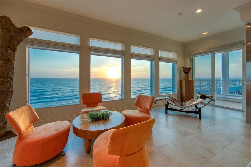 Natural materials and textures, and bold, clean lines work in perfect harmony with stunning panoramic views of The Gulf of Mexico. Occupying the entire floor, this spacious, contemporary condominium embraces modern luxury with a coastal punch. Take the elevator to your private floor where you will immediately feel the comfort created by the sleek, open concept design. The welcoming foyer opens to a grand living room featuring a magnificent floor to ceiling concrete fireplace with lighted glass panels and mural like picture windows gazing out to unobstructed Gulf views. The custom kitchen, a chef’s dream, is both functional and beautiful with concrete countertops and backsplash, mahogany and stainless steel cabinets, and top-of-the-line appliances, including a Thermador coffee system, GE Monogram oven and warming drawer, Bosch dishwasher, and SubZero refrigerator. Many of the kitchen drawers include customized features such as a spice rack, knife drawer, pull out pantry drawers, while the peekaboo backsplash windows offer water views and enhanced natural lighting. Enjoy a quick meal at the breakfast bar or a more formal meal in the perfectly sized dining room. A spacious, separate media room flows effortlessly from the kitchen and has custom built-in cabinetry with a hidden wet bar and mini refrigerator. In addition, you will enjoy a custom audio video system throughout the house. Each bedroom has fantastic views and spacious California Closets. The master bedroom suite has two walk in closets, a private balcony overlooking the Gulf and an elegant bathroom with concrete countertops, glass framed shower, and soaking tub. After touring this home, you won’t be surprised to know that it has been featured in several magazines including House Trends Tampa Bay, Florida Design, and DuPont Registry Tampa Bay. Whether you prefer the early morning calm of a sunrise, or the relaxing glow of an evening sunset, the views from this condo will not disappoint!