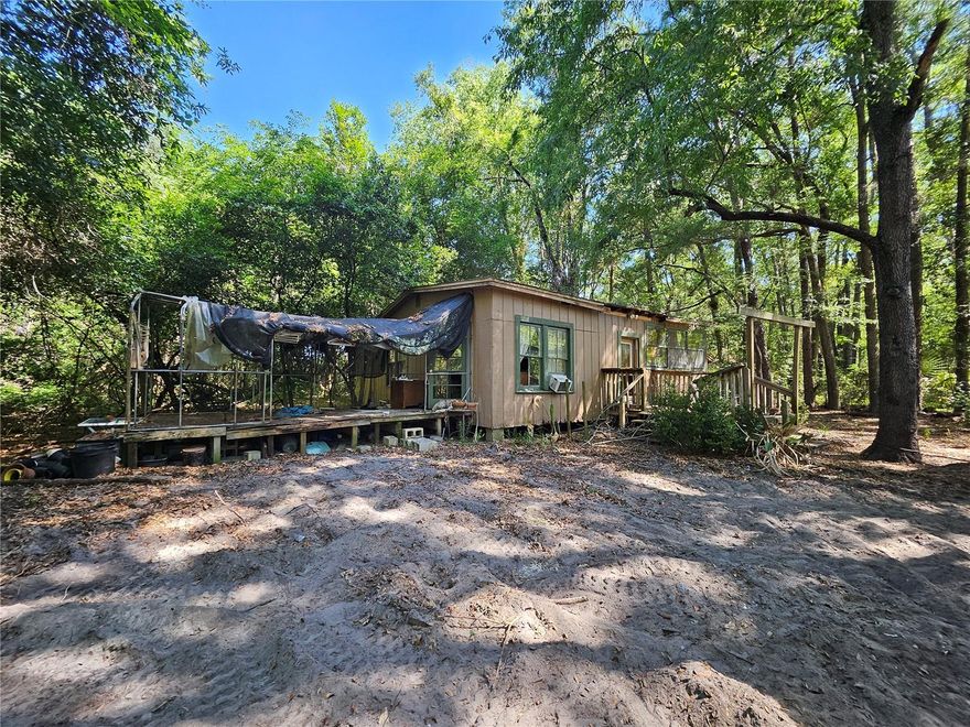 Investor Special with “Character” (and then some!)
If walls could talk… this 2-bedroom, 1-bath cottage would probably ask for a makeover. Sitting on a generous 0.47-acre lot, this property is not in the best condition—but that’s where your vision (and maybe a toolbox… or a bulldozer) comes in.
Whether you’re ready to roll up your sleeves and bring this old cottage back to life, or you’d rather start fresh and build your dream home from the ground up, this lot gives you the space to do it all. Backyard oasis? Workshop? Garage for all the toys? Go for it.
Located just 6 miles from the University of Florida and a short drive to Gainesville, the location is a win—even if the house needs a little… okay, a lot of love.
Being sold as-is—what you see (and what you uncover) is what you get. Who knows… maybe there’s hidden treasure buried somewhere on those 0.47 acres.
Bring your imagination—and maybe your contractor—and turn this diamond in the very rough into something amazing!