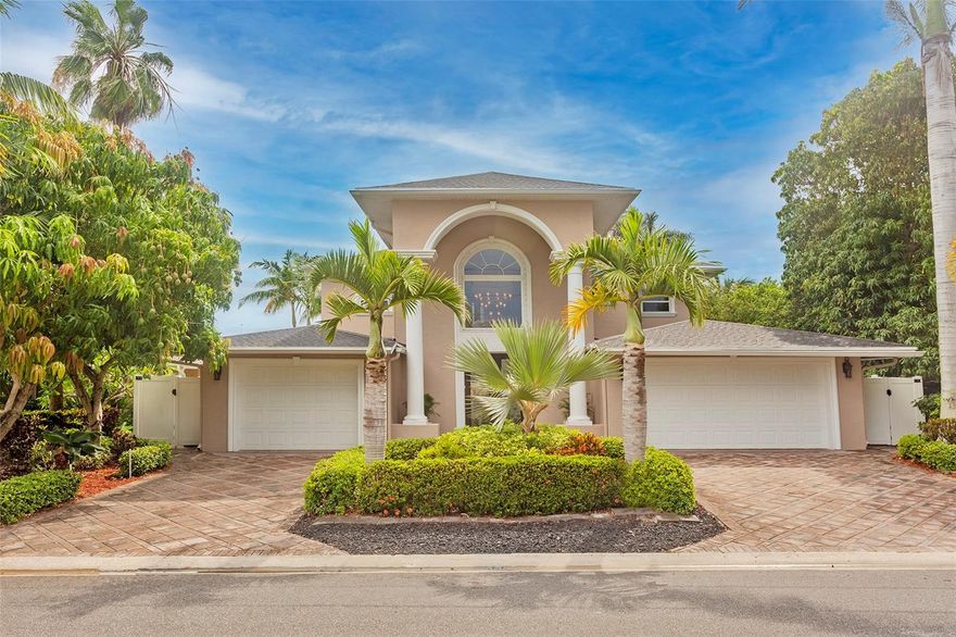 Spectacular, rare waterfront home in the beautiful Isle of Capri just minutes to the Gulf of Mexico by boat. This house with its 3 stories has 4 bedrooms, 4 and 1/2 baths, a bonus room, garage space for 3 cars, split 2 and 1, 800 square feet of covered porches and tons of closet space. The ground floor begins with a beautiful 2-story foyer that leads into the main house tiled throughout with an open floor plan, 10 ft ceilings, kitchen with granite counters, living room, dining room, 3 bedrooms of which 2 rooms have en-suite bathrooms and one with sliders right out to the pool. From the foyer, ascend a stunning staircase to the master suite, complete with living room, dining room, half bath, laundry room, master bedroom, master bath, a dream master closet that is 16ft by 16ft, and a balcony with amazing views of the intracoastal waterway. From your master suite balcony, ascend a spiral staircase to a bonus room on the third floor that can be used as an office, media room, workout room or just plain party room with a bird's eye view of St. Petersburg. From the main living room and dining room, walk outside to your large covered patio, your pool, surrounded by luscious landscaping and onto the extra-large dock with a 12k lb boat lift on one side and davits on the other side for a smaller water craft. All new paint and ceiling fans inside, new roof, new flooring on 2nd and 3rd floor. New sliding glass doors on ground and second floor. So many other extras to see!