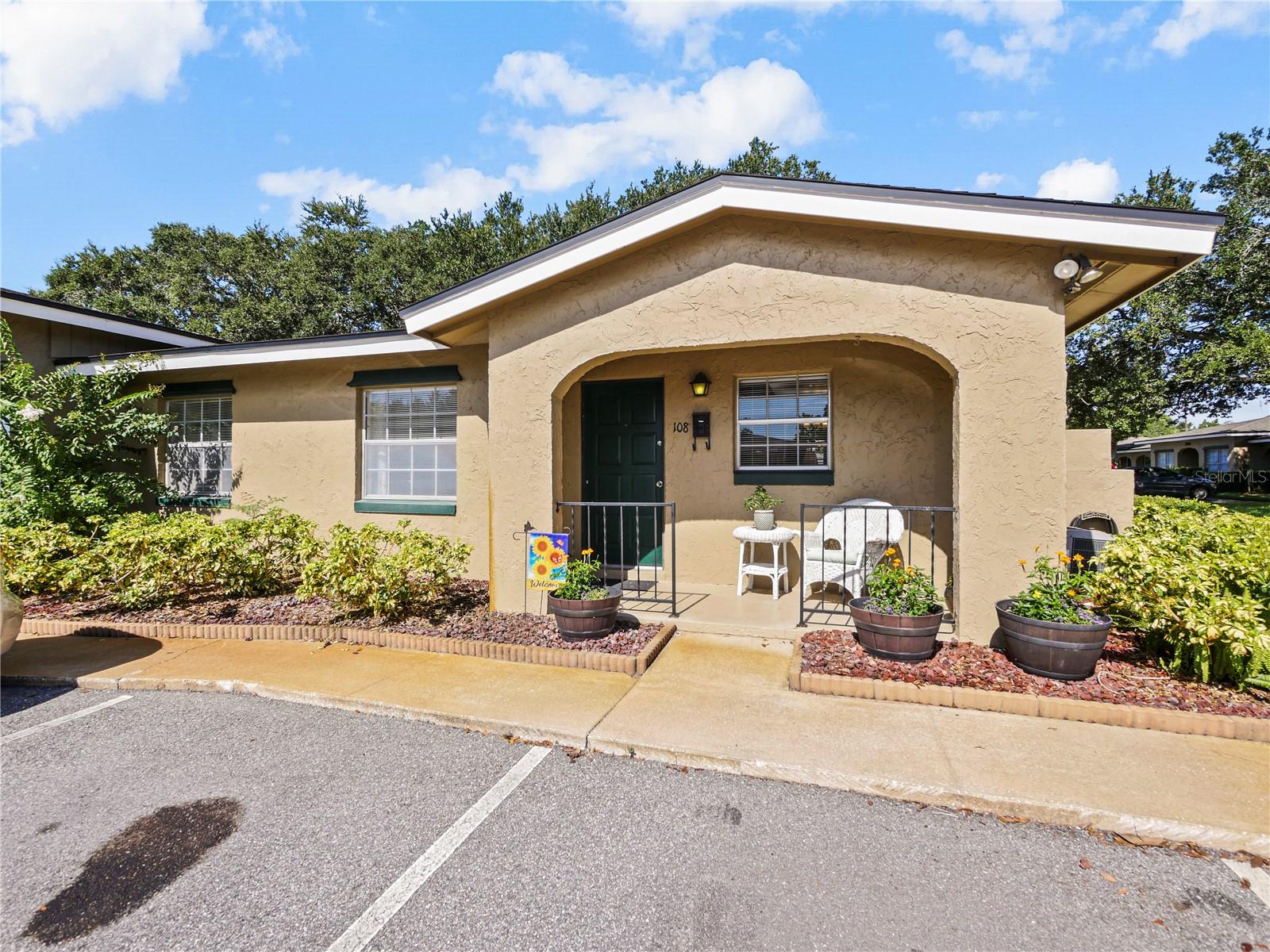 This Adorable 2-bedroom, 1 bath, One-Story Condo is located in the Peaceful Summit Village neighborhood full of gorgeous Mature Oak Tree lined Sidewalks and Luscious Landscape. This Cozy unit features out front parking and just steps a way from your lovely Front Porch Entry that takes you into a nice Foyer open to a spacious Living and Dining room complete with Gorgeous Natural Lighting and Ceramic Tile throughout offering a Stunning Mirrored Wall adding Great Depth to the space. Enjoy cooking in this Charming Kitchen offering nice Natural Light from the Front Window, complete with a Refrigerator, oven, countertop microwave, nice cabinet space, and an Open Buffet passage to the Dining area! Enjoy eating outside on your Private Side Patio with an additional area for outdoor grilling! A spacious Master Suite and a nice sized Walk-in Closet, a spacious 2nd bedroom, a full bathroom with a tub and shower combination, and additional linen closet. Interior large Laundry Room with full size Washer & Dryer, water heater, and additional shelving for storage. Upgrades include ceiling fans, light fixtures, & a Newer Roof installed in 2018. Amenities include water and trash services, three pools, tennis courts, clubhouse, and in a very Pet and Neighbor Friendly community. Perfect for a First-Time Home Buyer or a relaxing Retirement Home offering a great location to I-4, 429, and 417 to commute easily to The Sanford and Orlando International Airport, UCF, Attractions, Beaches, and more!