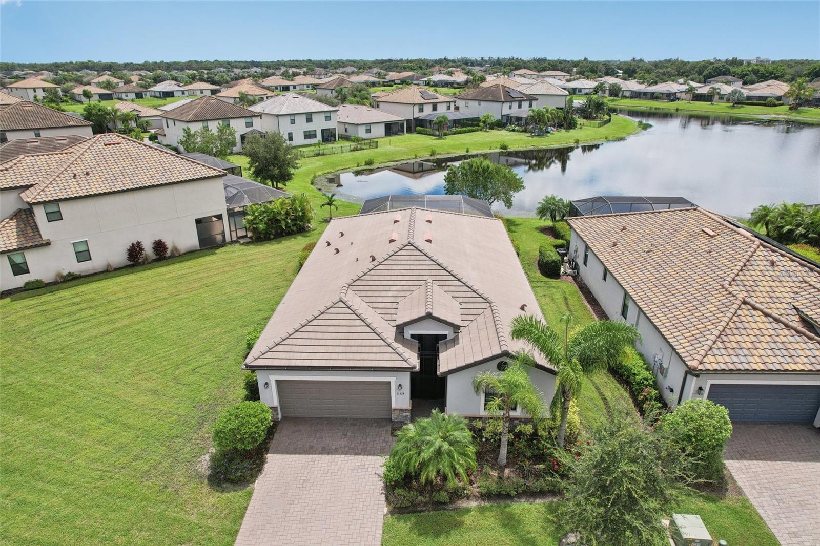 One or more photo(s) has been virtually staged. Come enjoy the good life in this spacious, waterview, 4-bedroom, 3-bath home offering 2,006 square feet of thoughtfully designed living space. The split floor plan provides both privacy and flow, while the open kitchen, dining, and great room create a natural gathering spot for meals and memorable get-togethers. Gorgeous tile and LVP flooring throughout.
Step outside and embrace the Florida lifestyle—whether it’s relaxing on the lanai, cooling off in the screened-in pool, or simply savoring the peaceful waterview surroundings. The roomy 2-car garage offers plenty of space for vehicles and storage.
Located in the sought-after Copperleaf gated community, you’ll enjoy the perks of resort-style amenities including a sparkling pool with serene lake views and full-service lawn care. Just minutes from downtown Bradenton, the Riverwalk, and across the street from a championship golf course, this address puts you at the center of it all.
Commuting and travel are a breeze with easy access to Sarasota, St. Pete, Tampa, and three major airports—all within an hour. Plus, three top hospitals are just 15–25 minutes away. Whether you’re relocating for work, looking for a seasonal retreat, or investing in a low-maintenance lifestyle, this home offers the perfect balance of comfort, convenience, and location.