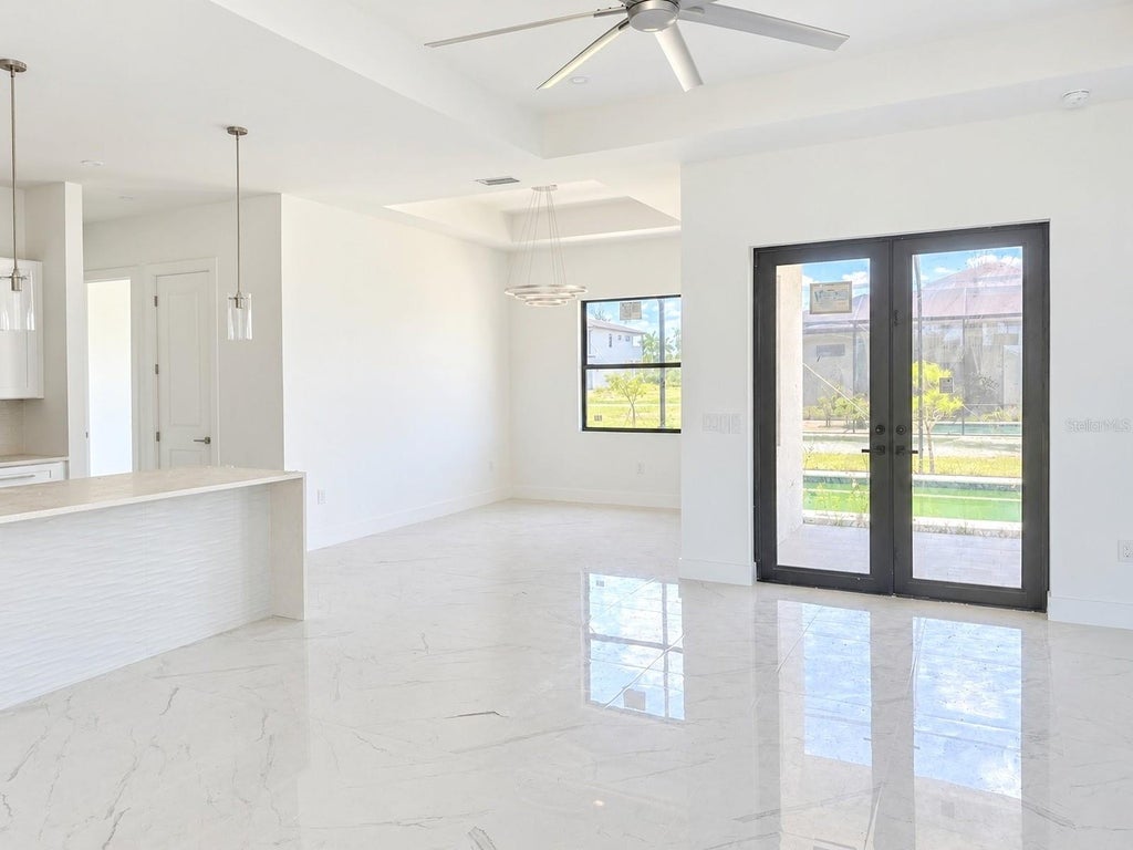 Photo of 2327 NW 37th Avenue, Cape Coral, FL 33993 (MLS # O6453069)