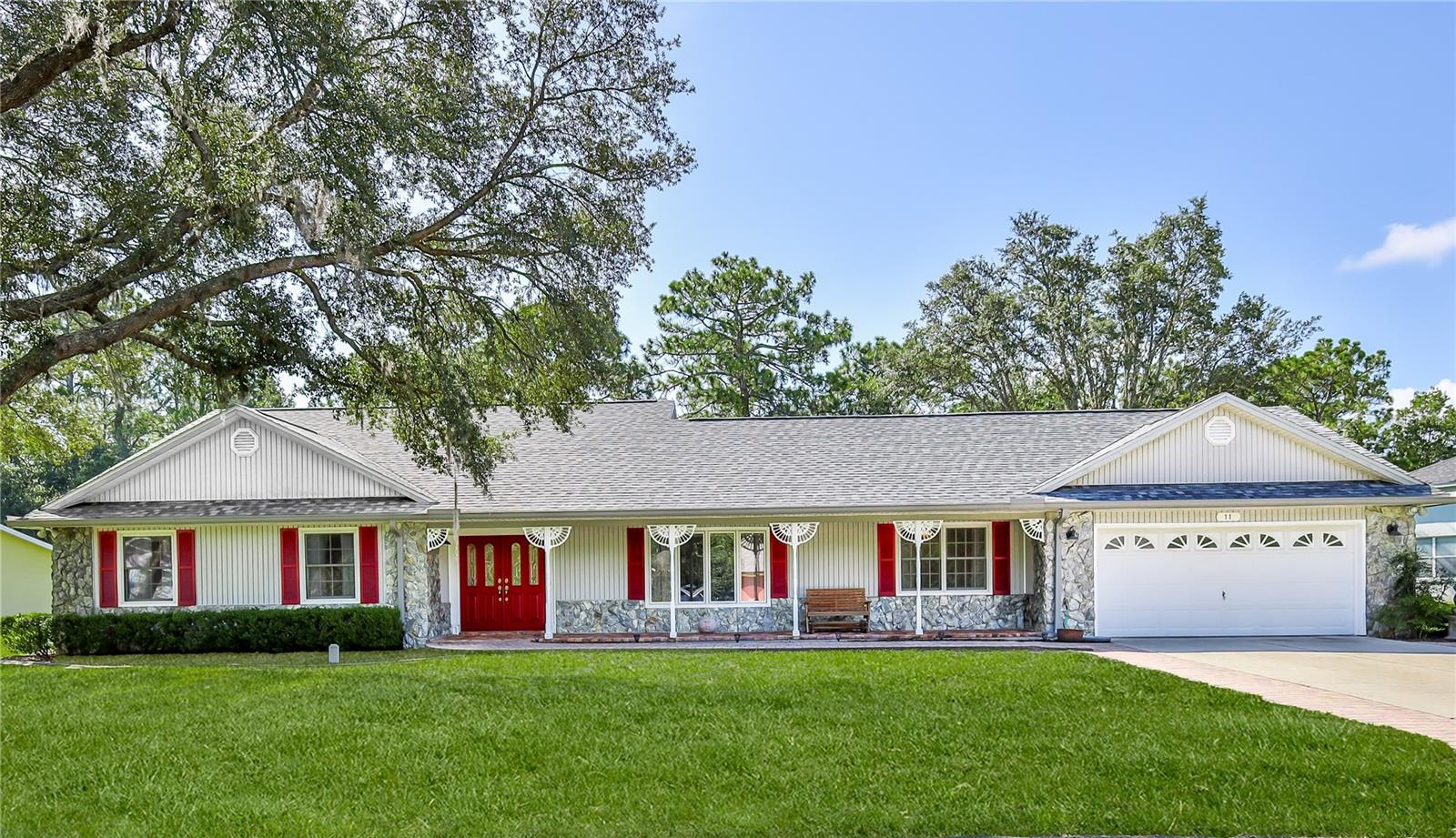 WELCOME HOME! This unique custom-built home offers 3 bedrooms plus an office/flex space. A BRAND NEW ROOF was installed 05/2024. Thoughtfully designed and full of character, this home is located in the peaceful, Golf community of Sugarmill Woods in beautiful Homosassa, Florida. From the moment you arrive, you will be greeted by the beautiful front porch adorned with brick pavers. You can only appreciate the quality craftsmanship of the wood finishes and smart layout. The home features a formal living room and dining room, both showcasing stunning eclectic wood ceilings that bring warmth and personality to the space. Seeing it in person you will appreciate the one of a kind stunning wood finishes and layout. The spacious kitchen is designed for both form and function, featuring a breakfast bar and central island, ample cabinet space with roll-out shelving, and an amazing walk-in pantry to keep everything organized. Step outside to your screened-in patio, where you can enjoy your morning coffee or unwind while surrounded by nature. The family room is the heart of the home, offering a comfortable space to relax, complete with a wood-burning fireplace—perfect for cozy evenings or entertaining guests. The spacious primary suite offers a walk-in closet, an ensuite with a separate shower and garden tub large walk-in closet. On the opposite end of the home is a large laundry room with lots of cabinets. Also an adjoining office/flex room and an additional half bathroom. Possibly serving as an in-law area or private retreat for guests. The spacious backyard has plenty of room for a pool and backs up to a greenbelt, offering beautiful green space and added privacy—a perfect setting for outdoor living. The beautiful golf community of Sugarmill Woods offers very low HOA fees and no mandatory social membership, giving you flexibility and affordability. You'll have the option to join a variety of amenities, including golf memberships (or pay-as-you-play), as well as access to social programs like the country club restaurant, fitness center, swimming pool, pickleball courts, and more.