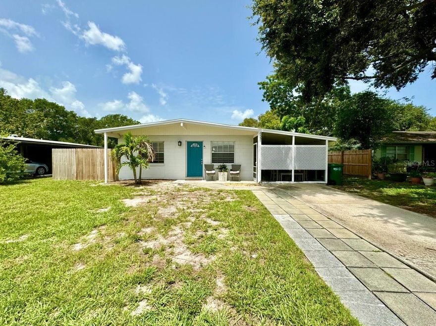 Absolutely charming South Tampa home on a HUGE lot! Situated on over a quarter of an acre, this 3 bedroom 1 bath property is a great starter home, rental property, or perfect for seasonal use. Offering a large, newly updated kitchen with quartz counters, original terrazzo flooring throughout, and spacious closets. Extremely large backyard, which is perfect for enjoying the Florida sunshine! Plenty of room for pool or storage building. No Home Owners Association to contend with, and convenient to all that Tampa has to offer, this cute house has tons of potential!