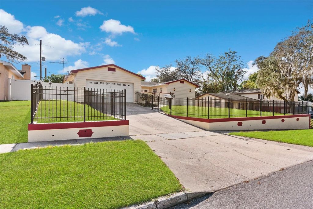 Photo of 6120 Castlewood Lane, Orlando, FL 32808 (MLS # O6369162)