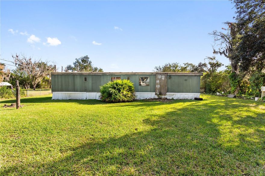 Investor special or fixer-upper opportunity in Lakeland! Situated on a spacious, fully usable lot, this property offers a rare chance to own a large yard with room to expand, garden, add outdoor amenities, or reimagine the space to fit your vision. The manufactured home is in need of updates and repairs, making it ideal for investors, renovation buyers, or those looking to customize from the ground up. A newer septic system was installed not long ago, providing added value and peace of mind. Conveniently located with easy access to major roads, shopping, and dining while still offering a more private, rural feel. Property is being sold AS-IS.