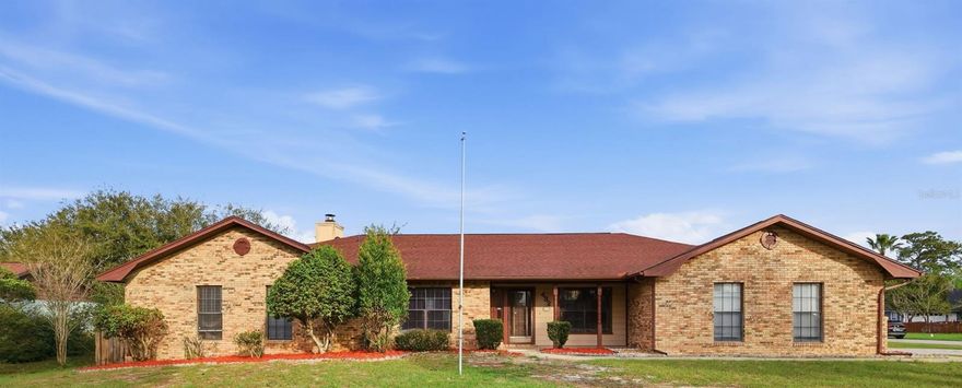 One or more photo(s) has been virtually staged. Welcome to a rare opportunity in DeBary’s established golf community, where space, charm, and flexibility come together on an oversized corner lot of more than half an acre. Located within a great section of Glen Abbey with no HOA, this home offers the freedom to live without restrictions while enjoying the character of a well-established community.

From the moment you arrive, the expansive homesite and corner positioning create a sense of openness and privacy that is hard to find. Inside, you’ll find soaring ceilings and a light-filled interior that enhances the home’s spacious feel. The layout features defined living and dining areas, complemented by a cozy wood-burning fireplace that serves as a warm focal point for gatherings.

The kitchen offers solid surface countertops and ample cabinetry, blending functionality with timeless appeal. A split-bedroom floor plan provides privacy, while the primary suite offers a quiet retreat. The home’s layout reflects its era with traditional spaces, yet provides a solid foundation for modern updates if desired.

Step outside to a fully fenced backyard with endless potential—perfect for entertaining, pets, or simply enjoying the outdoors. The oversized lot provides room to expand, garden, or create your own private oasis. Two detached storage buildings, including a workshop space, add versatility for hobbies, tools, or additional storage.

Located within a golf community setting, residents enjoy scenic surroundings with mature landscaping and a relaxed atmosphere. While the golf course is public, it enhances the neighborhood’s appeal. Conveniently positioned near shopping, dining, parks, The SunRail and major roadways including I-4, this location offers easy access to Orlando, Lake Mary, and the beaches.

Outdoor enthusiasts will appreciate proximity to Gemini Springs, Blue Spring State Park, the St. Johns River, and numerous walking and biking trails, making this area ideal for those who enjoy an active lifestyle.

With its combination of lot size, location, and potential, this property presents a unique opportunity to create something truly special in one of DeBary’s most desirable areas.