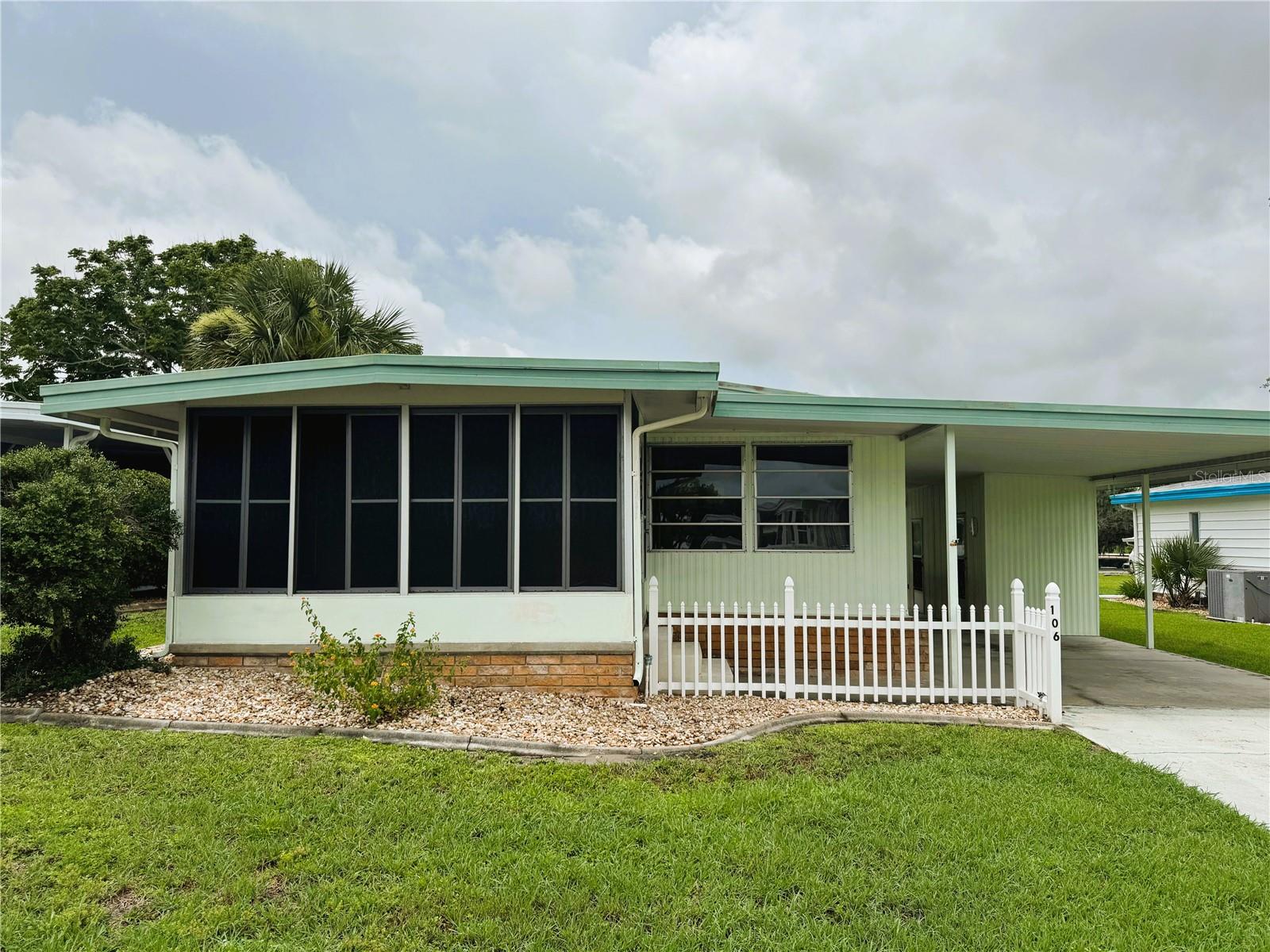 Welcome to this charming two-bedroom, two-bath home located on Azalea Trail in the heart of Hawthorne at Leesburg, one of Central Florida’s most desirable 55+ communities. This inviting home is just a short walk from both the community pool and clubhouse, offering convenience and a lifestyle of ease. Inside, you’ll find carpet throughout, a spacious kitchen with generous cabinet space, and a bright Florida room that provides the perfect space for relaxing or entertaining guests. The guest suite features a Jack and Jill bathroom and a built-in dresser, adding both comfort and functionality.
While the home does require some TLC, including addressing soft spots in the flooring, this has been factored into the competitive pricing, presenting an excellent opportunity to make it your own. With a little attention, this home could easily be transformed into your ideal Florida retreat.
Hawthorne at Leesburg is a vibrant, amenity-rich community designed for active adults seeking an affordable and engaging lifestyle. For just $346 per month, residents enjoy a maintenance-free living experience that includes water, sewer, lawn care, and emergency services. The community features a beautifully maintained clubhouse, home to over 100 organized activities, as well as card rooms, a billiards area, a library, fitness center, fine arts studio, and more. A full-time program coordinator ensures a dynamic calendar of social events and activities throughout the year.
Boating enthusiasts will love the private marina with over 120 boat slips and direct access to the scenic waters of Lake Harris. For added peace of mind, the community is staffed 24/7 with on-site firefighter/EMTs, emergency vehicles, and in-home emergency response systems. The golf cart-friendly layout allows easy access to nearby shopping, dining, and medical facilities, while nature lovers will appreciate the walking trails, tranquil lake views, and abundant opportunities for fishing and boating.
This home offers more than just a place to live—it’s your gateway to an enjoyable, connected, and fulfilling lifestyle. Schedule your private showing today and discover everything Hawthorne at Leesburg has to offer.