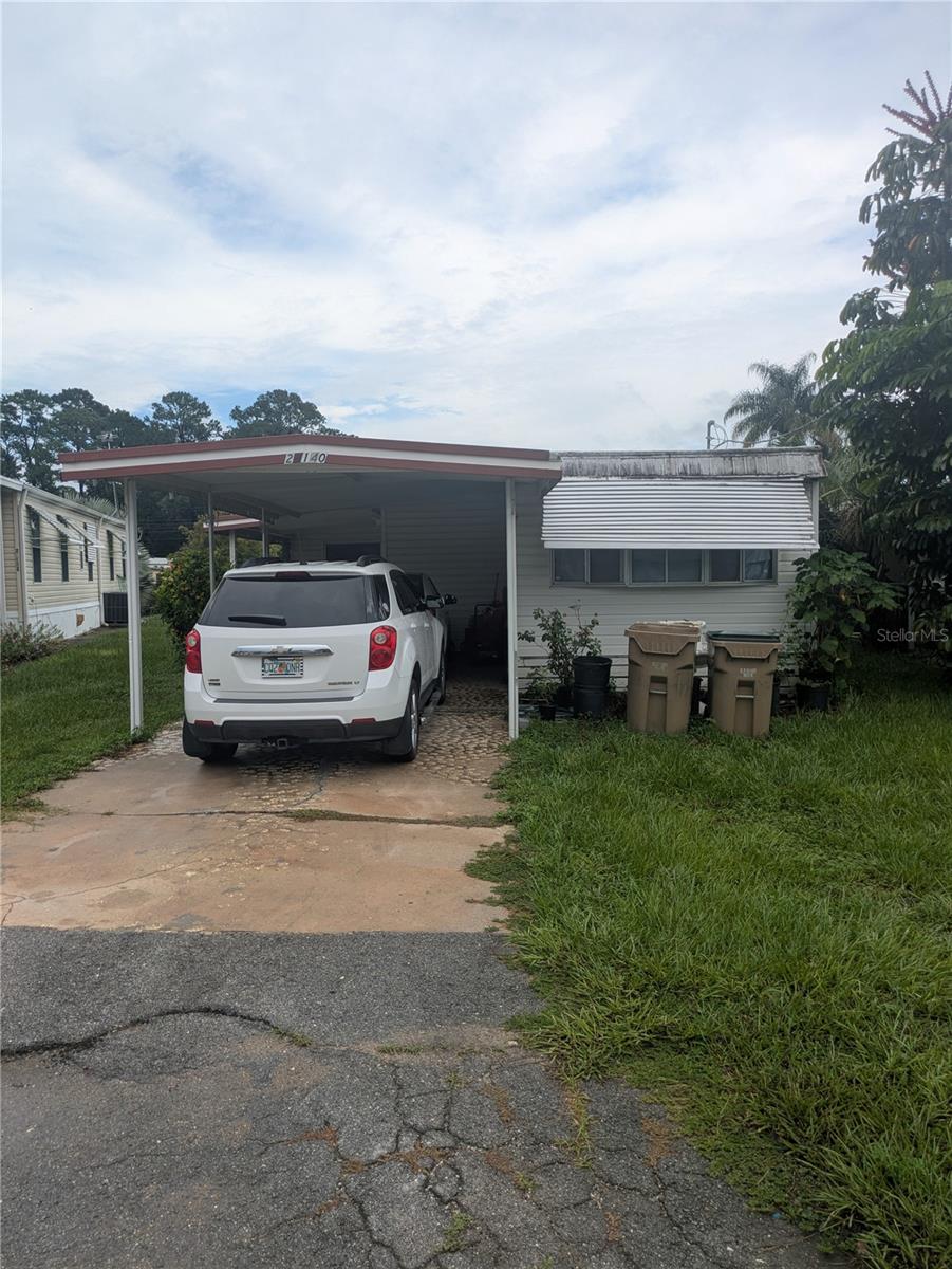 Clean, well taken care of, mobile home with a boathouse on a canal that leads directly to Little Lake Harris; perfect for a vacation home, a spot to launch your boat, or a great investment for buy and hold!