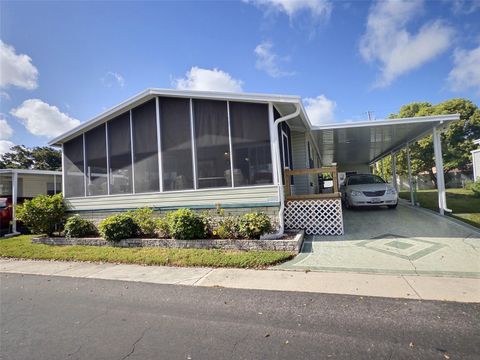 Photo of 136 Pindo Palm Street W, Largo, FL 33770 (MLS # TB8521636)