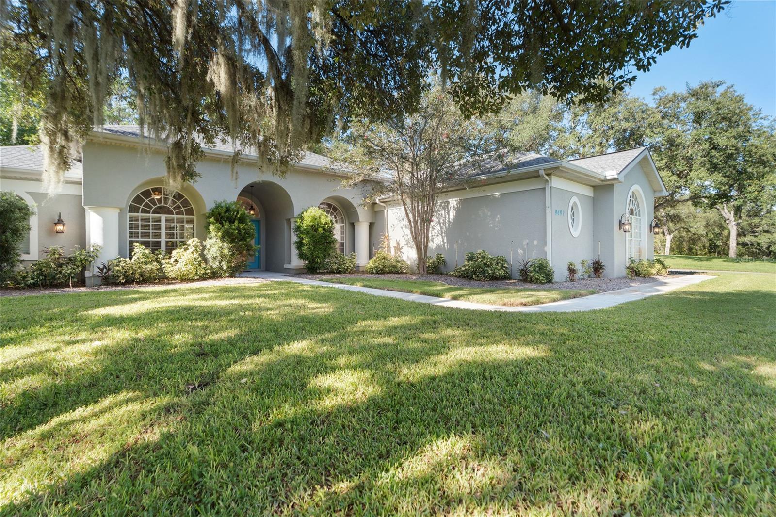 Exquisite, coveted Florida pool home in the Woodland Waters Community. Located five miles from Weeki Wachee Springs State Park and just minutes from boat ramps to the Gulf. The house is situated on a one-acre lot less than 2 blocks from the community tennis courts and within proximity to the boat ramp at Tooke Lake. Low HOA dues are only $175.00 for the year. The roof was replaced in 2020. This popular floor plan boasts two flex bonus rooms with ideal for a home office, workout or craft spaces, playroom or home gym. Beginning at the front entrance of the home are six carriage lights and two large column pillars. Step through the double door entryway and gasp at your view of this lovely modern home that has a direct view of the pool. The home is centered around the kitchen with modern cabinetry, stone countertops, stainless appliances, a pantry, breakfast bar and ample recessed lighting. The kitchen has a view of the living area, breakfast nook and pool. The kitchen is near the indoor utility room and garage. The left side of the home features a bonus room with French glass doors, a closet and murphy bed, the primary bedroom with private ensuite, and the half bath that exits out to the pool and lanai. The ensuites ample size is nice and bright with a large window for natural light, a soaking tub, separate shower, large vanity with double sinks, water closet, walk in closet and separate closet. On the right side of the home are two bedrooms and a bathroom with shower. The simple elegance of this home has a hint of farmhouse décor with a barn door at one of the flex rooms. High ceilings create that spacious awesomeness. The home is nice and bright boasting large windows and many glass transoms. There are three sets of sliding glass doors which lead to the lanai and pool. Most of the home has luxury vinyl plank flooring except for the bathrooms which has ceramic tile. The landscape on this property is much to be desired with a healthy lawn with irrigation connected to a well, a large shaded oak tree in the front yard a stately palm, Flag pole, and a cluster of Florida pines at the back side of the property. An long driveway with ample space to park plenty of cars when your ready to entertain guests. The shed at the South end outside the lanai conveys with the home. This property is within a one hour drive to Tampa International Airport. This home will qualify for VA, FHA and Conventional Financing. Video presentation will be posted Sunday.