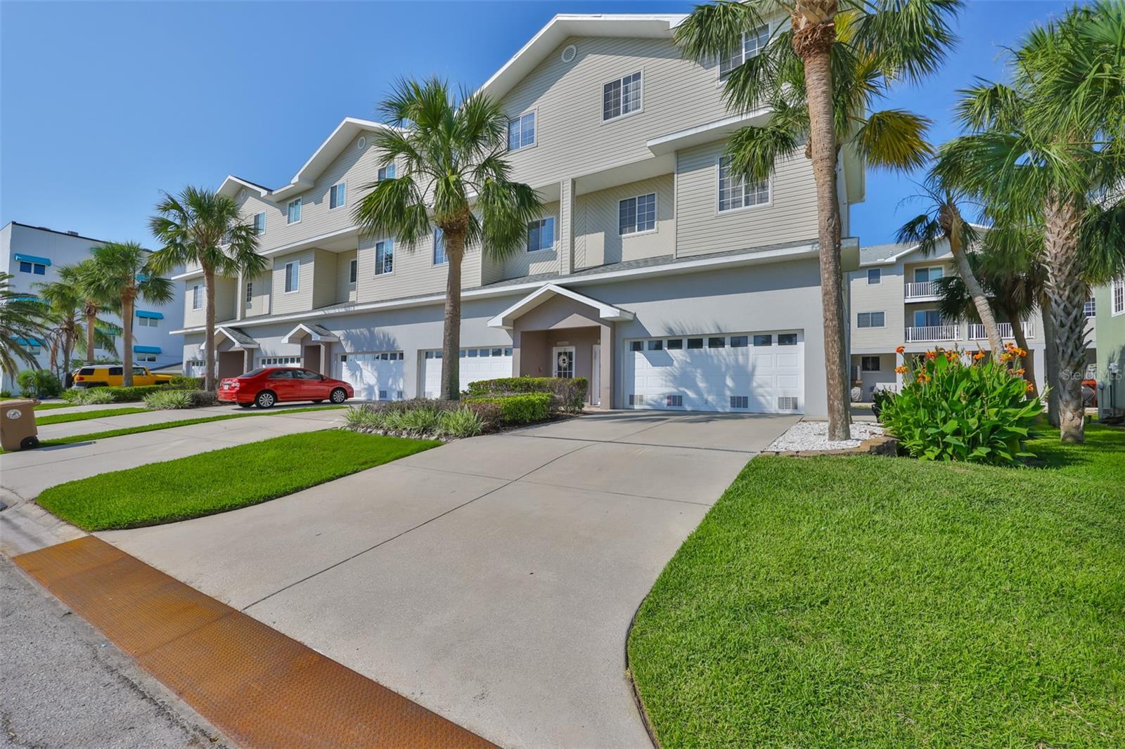 Experience the best of coastal living in this rare 4-bedroom, 3.5-bath end unit, located just a 3-minute walk from the soft sands and shimmering waters of stunning Madeira Beach. This spacious multi-level home is ideal as a primary residence, vacation retreat, or investment property, offering a perfect combination of comfort, space, and beachside convenience.
With over 2,000 square feet of bright, open living space, this home features a well-designed layout ideal for both entertaining and everyday living. As an end unit, it enjoys added privacy and abundant natural light throughout. The home includes two primary suites—one on the second floor with its own private entrance, perfect for guests or multigenerational living, and a second on the top floor alongside two additional bedrooms.
A private in-unit elevator provides easy access to all levels, and the attached two-car garage offers generous storage and convenience.
The garage and entry-level foyer did experience water damage, but the homeowners association has already secured permits and is in the process of completing all necessary repairs—giving you peace of mind and ensuring the home is restored to excellent condition.
Ideally located just a 5-minute drive to the shops, dining, and waterfront boardwalk of popular John’s Pass, this home is also close to a variety of local restaurants, shopping, and entertainment options.
This is your opportunity to own a spacious, beautifully designed beachside home in one of Florida’s most sought-after coastal communities. Don’t miss out—schedule your private tour today.