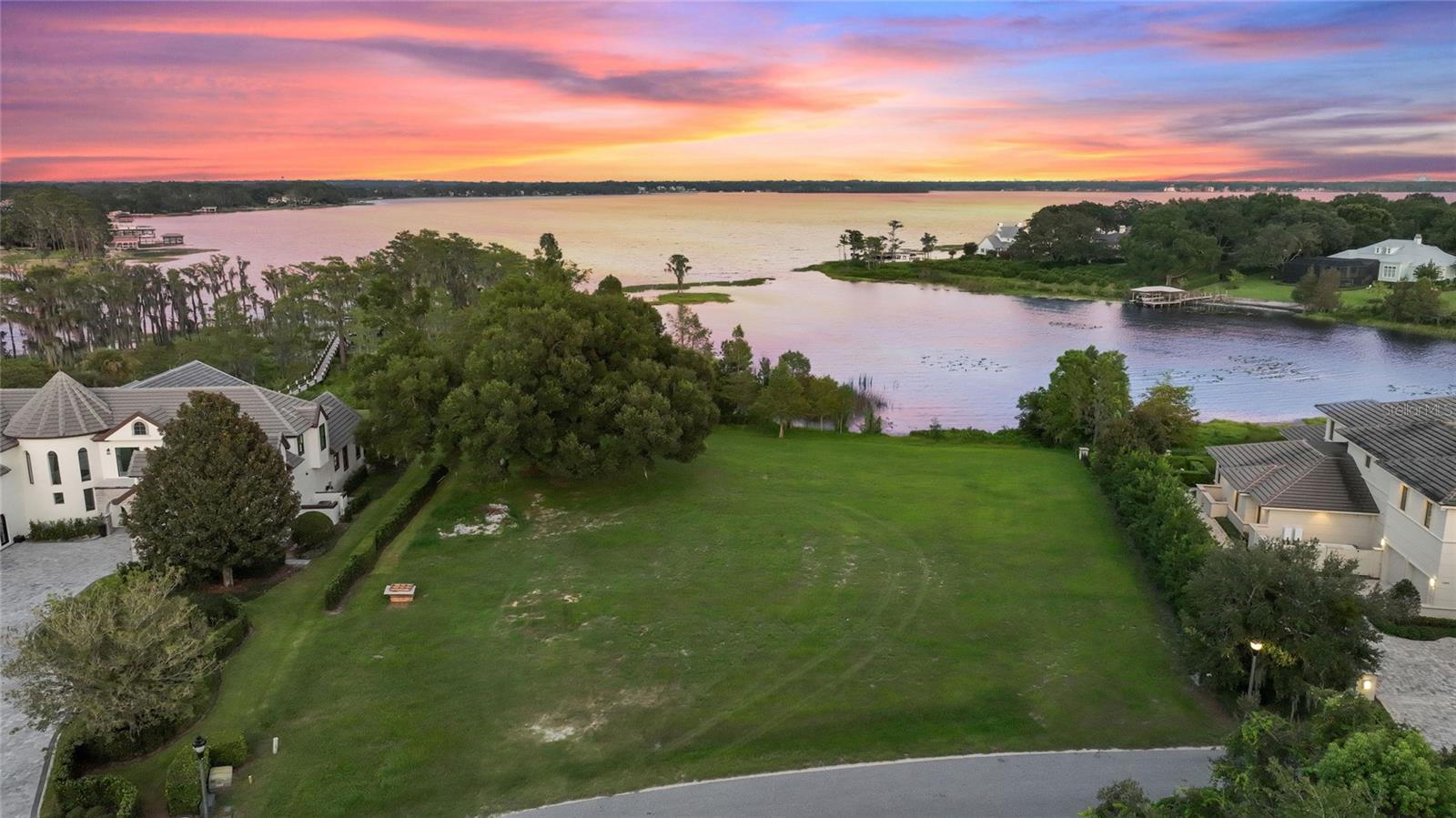 Welcome to Chaine Du Lac, an exclusive gated community that offers the ultimate luxury lakefront living experience. This is a unique chance to own a piece of paradise, located in the idyllic Windermere area, and part of the Butler Chain of Lakes. This property is a hidden gem that boasts clear views of Lake Butler, surrounded by lush greenery and an immaculately manicured neighborhood. The land is perfect for those seeking to build their dream home with breathtaking views of the water and the stunning sunsets that Florida is famous for. The Chaine Du Lac community is well-known for its luxurious homes, and this lot offers the chance to become a part of this exclusive enclave. With the Butler Chain of Lakes as your playground, you can enjoy water sports, fishing, and boating right from your doorstep. This is a once-in-a-lifetime opportunity to own a piece of prime real estate in one of the most sought-after neighborhoods in Windermere. So, if you're looking for a serene oasis away from the hustle and bustle of city life, this land is the perfect place for you. Come and experience the ultimate lakefront lifestyle that Chaine Du Lac has to offer!
