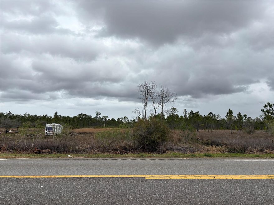 Rare opportunity to own 2.31 acres of vacant land with highway frontage on State Road 60 in East Lake Wales, Polk County. Large acreage parcels along this corridor are becoming increasingly difficult to find, making this an excellent opportunity for buyers looking for land, rural acreage, or long-term land investment in Central Florida.

This 2.31 acre property offers excellent visibility and convenient access along a major east-west highway while still providing the peaceful rural setting East Polk County is known for. 

The property is located just a short drive from Lake Wales, Lake Kissimmee, and some of Polk County’s most popular fishing, boating, and outdoor recreation areas, making it an attractive option for those seeking Florida country living with convenient highway access.

An existing driveway entrance from State Road 60 is present, however the driveway and culvert improvements remain unfinished and have not received final inspection or approval from the Florida Department of Transportation (FDOT). Buyer to verify access requirements, permitting, and any improvements needed for completion. Wetlands, flood zone status, and environmental conditions are unknown. Buyer to perform all due diligence and verify environmental, zoning, land use, and building requirements with the appropriate authorities.

If you have been searching for vacant land, acreage property, or highway frontage land in East Polk County, this 2.31-acre parcel offers a unique opportunity in an area with limited land inventory.