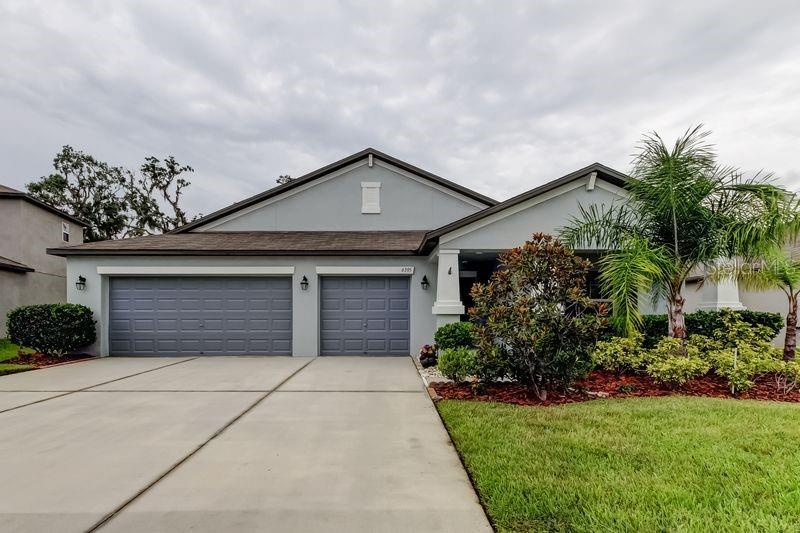 Welcome to a pristine 2019-built home nestled in the vibrant Silverado Ranch community of Zephyrhills. This beautifully maintained residence offers a perfect blend of modern comfort and energy-efficient upgrades and recently painted exterior! You will love the open-concept design of this beautiful one-story home. The Santa Fe floorplan expands to 2,576 square feet and features a 3-car garage, 4 spacious bedrooms and 3 bathrooms with the 3rd Bedroom has on suit bathroom. The main living area boasts an exquisite open-concept space for cooking, dining and entertaining guests. From the main living space, enter the master suite to find a beautifully designed space featuring a large bathroom with separate sinks and an oversized walk-in closet. The kitchen features 36" Staggered Andover Nutmeg raised square panel cabinetry, stainless steel appliances along with granite countertops. 18x18 Baja Tecate ceramic tile completes the look. Silverado offers great amenities for those who love to meet new friends and spend time outdoors. You can enjoy a cool dip in the resort-style pool on a warm summer day, let your pups frolic at the dog park, and tire out the kiddos at the tot lot. Located in the desirable Silverado Ranch community in Zephyrhills, FL, you'll appreciate the balance of peaceful living and accessibility to local amenities such as a community pool. This wonderful home is ready and waiting for its new owners. Don’t miss this opportunity to own a beautiful, practical home in a fantastic location. Schedule your visit today and take the first step towards making it yours! The nearby schools include West Zephyrhills Elementary School, Raymond Stewart Middle School, and Zephyrhills High School. Silverado Community is know for low fees, the HOA is only $60 a month! This home is only 5 minutes from the Sara Van Berg Tennis Center (say hello pickleball evenings), twenty minutes from the Tampa Outlets, about 7 minutes from the Epperson Lagoon, thirty minutes from Downtown Tampa, about forty five minutes from Tampa International Airport, an hour and a half from Walt Disney World and Orlando Theme Parks, and about fifty minutes from the crystal clear water at Clearwater Beach. Schedule your tour today!