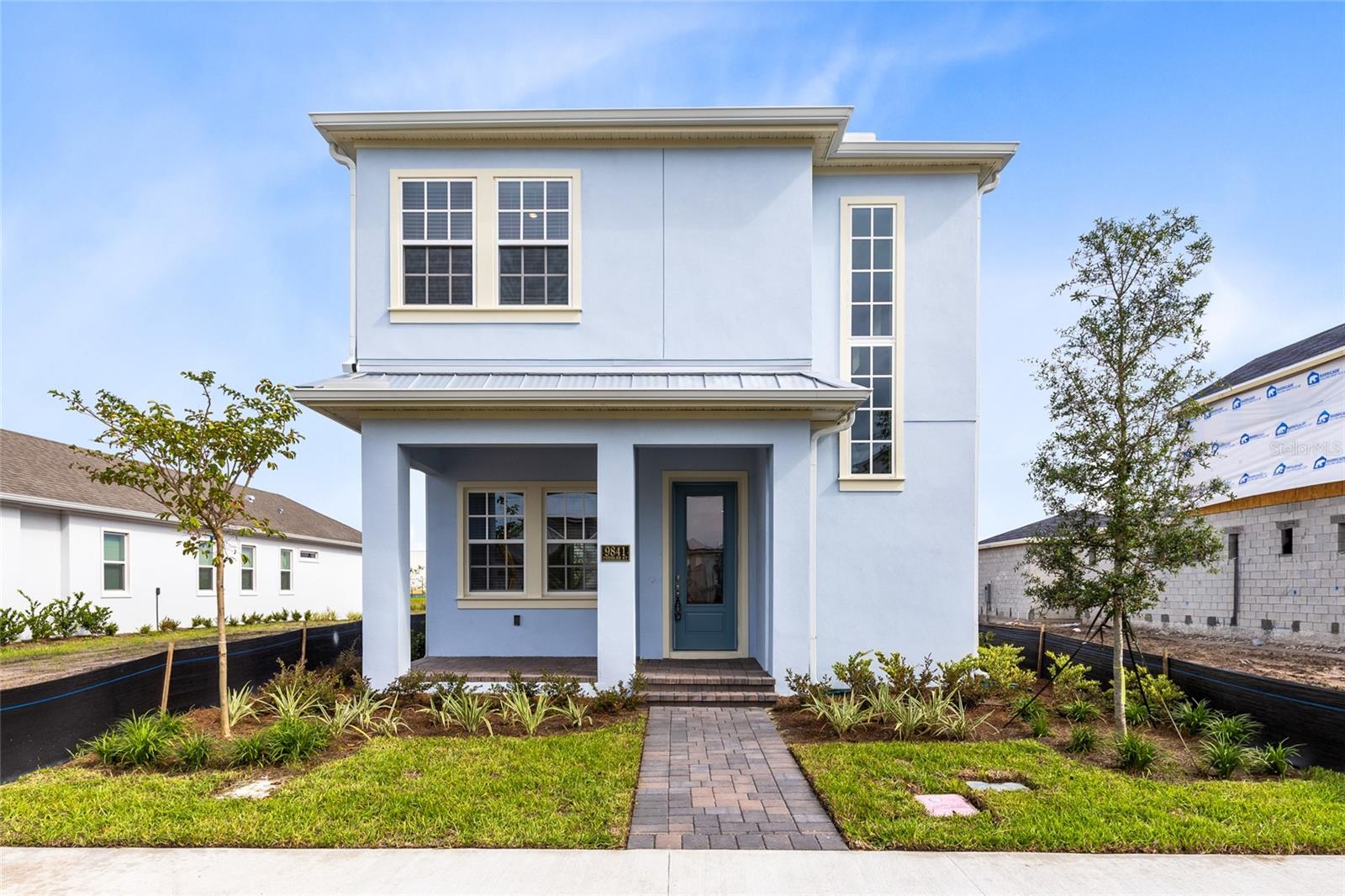 This stylish 4-bed, 3.5-bath home with a full 1-bed, 1-bath garage apartment is set in Lake Nona’s most sought-after community. The welcoming blue exterior and covered front porch create instant curb appeal, leading you inside to a bright and open interior.
The main level features a seamless flow between the living, dining, and kitchen spaces, filled with natural light. Neutral tile flooring runs throughout, complementing the fresh modern design. The chef’s kitchen offers white shaker cabinets, quartz countertops, stainless steel appliances, a sleek vent hood, and a spacious island with bar seating. French doors extend the living space outdoors to a private courtyard-style patio, ideal for entertaining.
Upstairs, the owner’s suite feels like a retreat with a dual-sink vanity, quartz counters, abundant storage, and a large frameless glass shower. Two additional bedrooms, a full bath, and a versatile loft complete the second floor, providing comfort and flexibility for family or guests.
The detached garage apartment includes a full kitchen, living room, bedroom, and bath—perfect for visitors, multigenerational living, or rental income.
Laureate Park isn’t just a neighborhood—it’s a lifestyle. Enjoy access to the Aquatic Center, LP Fit gym, playgrounds, and over 44 miles of trails. Minutes from Medical City, Nemours, the VA Hospital, Lake Nona Town Center, dining, shopping, and with easy access to Orlando International Airport, USTA National Campus, theme parks, and beaches.
This home blends modern design, function, and community living. Schedule your private tour today!