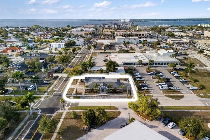 Position your business where visibility, accessibility, and community converge in downtown Punta Gorda. This established professional office building offers approximately 4,917± square feet of highly flexible commercial space designed to adapt to a variety of business needs. The interior layout includes multiple private offices, a conference room, reception area, kitchen/break room, three restrooms, and several large multi-use areas, allowing for efficient workflow and customizable configurations.
The property provides parking on three sides plus convenient street parking, enhancing ease of access for staff and clients alike. With quick access to US-41 and immediate proximity to downtown businesses, restaurants, waterfront parks, and civic amenities, the location delivers excellent connectivity and day-to-day convenience.
Punta Gorda is widely recognized for its vibrant, welcoming downtown and strong sense of community, making it a desirable destination for professional, medical, and service-oriented users. Zoned City Center District, this property allows for a broad range of permitted commercial uses and represents a compelling opportunity within one of the city’s most sought-after commercial corridors.